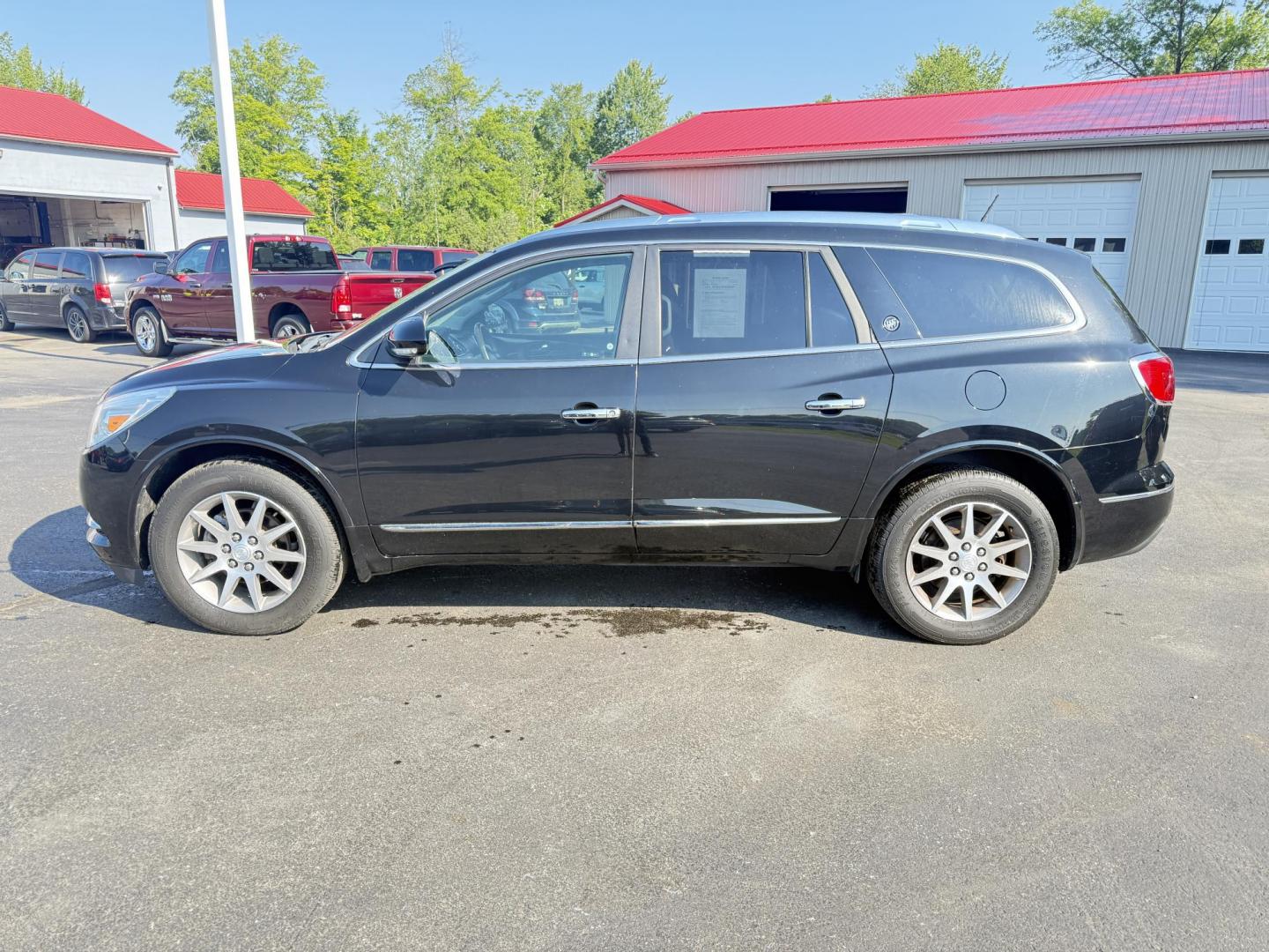 2017 Black /Black Buick Enclave Leather AWD (5GAKVBKD8HJ) with an 3.6L V6 DOHC 24V engine, 6A transmission, located at 547 E. Main St., Orwell, OH, 44076, (440) 437-5893, 41.535435, -80.847855 - This 2017 Buick Enclave Leather AWD is a well-equipped midsize SUV featuring a 3.6L V6 engine and 6-speed automatic transmission. It offers comfort and convenience with leather interior, power and heated front seats, tri-zone automatic climate control, and 2nd-row captain’s chairs. Technology high - Photo#12
