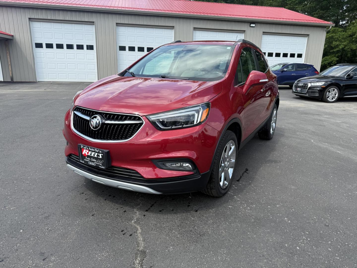 2017 Red /Tan Buick Encore Essence AWD (KL4CJGSBXHB) with an 1.4L I4 DOHC 16V TURBO engine, 6A transmission, located at 547 E. Main St., Orwell, OH, 44076, (440) 437-5893, 41.535435, -80.847855 - This 2017 Buick Encore Essence AWD is a stylish and versatile compact SUV featuring a 1.4-liter turbocharged I4 EcoTec engine paired with a smooth 6-speed automatic transmission, offering a commendable 31 MPG on the highway. Its luxurious leather interior, power driver’s seat, and an 8.0-inch touc - Photo#0