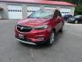 2017 Red /Tan Buick Encore Essence AWD (KL4CJGSBXHB) with an 1.4L I4 DOHC 16V TURBO engine, 6A transmission, located at 547 E. Main St., Orwell, OH, 44076, (440) 437-5893, 41.535435, -80.847855 - This 2017 Buick Encore Essence AWD is a stylish and versatile compact SUV featuring a 1.4-liter turbocharged I4 EcoTec engine paired with a smooth 6-speed automatic transmission, offering a commendable 31 MPG on the highway. Its luxurious leather interior, power driver’s seat, and an 8.0-inch touc - Photo#0