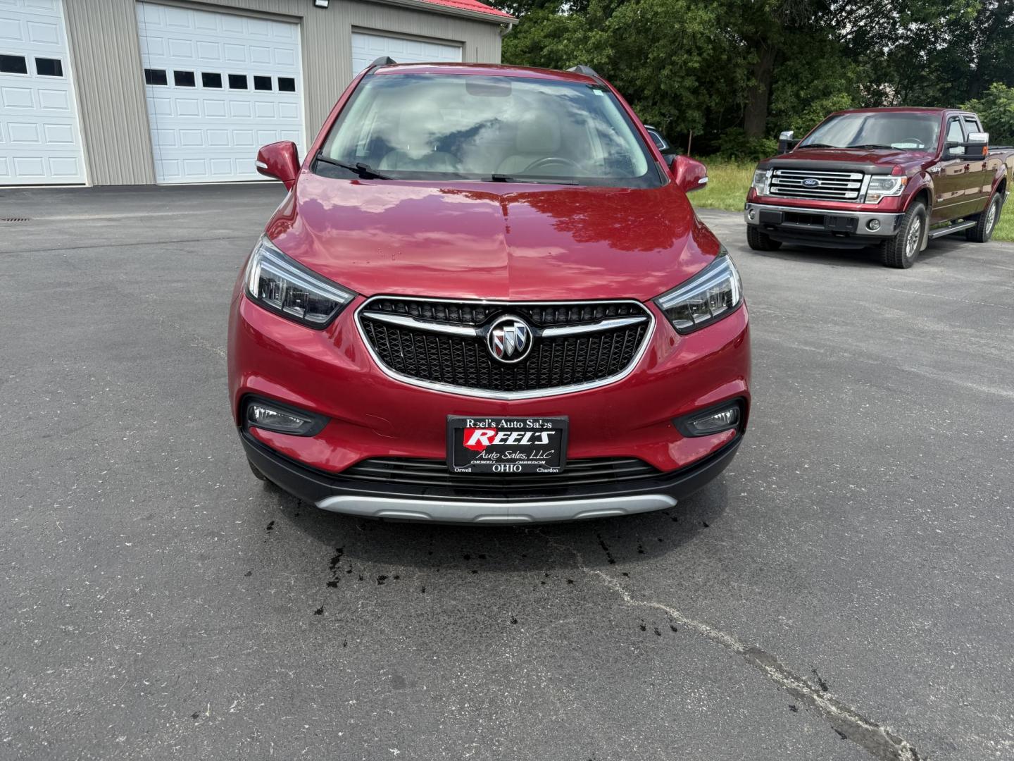 2017 Red /Tan Buick Encore Essence AWD (KL4CJGSBXHB) with an 1.4L I4 DOHC 16V TURBO engine, 6A transmission, located at 547 E. Main St., Orwell, OH, 44076, (440) 437-5893, 41.535435, -80.847855 - This 2017 Buick Encore Essence AWD is a stylish and versatile compact SUV featuring a 1.4-liter turbocharged I4 EcoTec engine paired with a smooth 6-speed automatic transmission, offering a commendable 31 MPG on the highway. Its luxurious leather interior, power driver’s seat, and an 8.0-inch touc - Photo#1