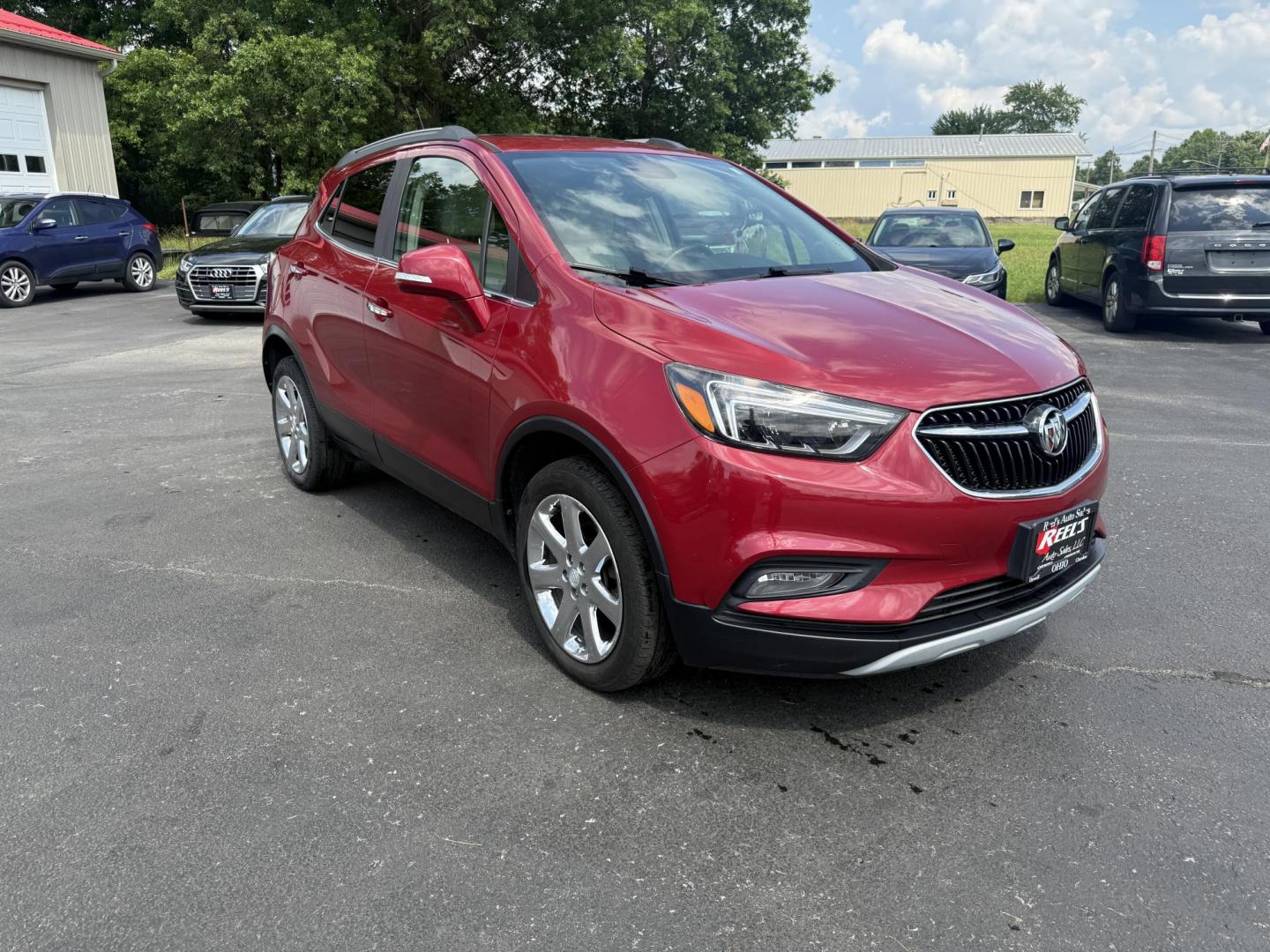 2017 Red /Tan Buick Encore Essence AWD (KL4CJGSBXHB) with an 1.4L I4 DOHC 16V TURBO engine, 6A transmission, located at 547 E. Main St., Orwell, OH, 44076, (440) 437-5893, 41.535435, -80.847855 - This 2017 Buick Encore Essence AWD is a stylish and versatile compact SUV featuring a 1.4-liter turbocharged I4 EcoTec engine paired with a smooth 6-speed automatic transmission, offering a commendable 31 MPG on the highway. Its luxurious leather interior, power driver’s seat, and an 8.0-inch touc - Photo#2