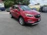 2017 Red /Tan Buick Encore Essence AWD (KL4CJGSBXHB) with an 1.4L I4 DOHC 16V TURBO engine, 6A transmission, located at 547 E. Main St., Orwell, OH, 44076, (440) 437-5893, 41.535435, -80.847855 - This 2017 Buick Encore Essence AWD is a stylish and versatile compact SUV featuring a 1.4-liter turbocharged I4 EcoTec engine paired with a smooth 6-speed automatic transmission, offering a commendable 31 MPG on the highway. Its luxurious leather interior, power driver’s seat, and an 8.0-inch touc - Photo#2