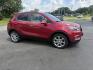 2017 Red /Tan Buick Encore Essence AWD (KL4CJGSBXHB) with an 1.4L I4 DOHC 16V TURBO engine, 6A transmission, located at 547 E. Main St., Orwell, OH, 44076, (440) 437-5893, 41.535435, -80.847855 - This 2017 Buick Encore Essence AWD is a stylish and versatile compact SUV featuring a 1.4-liter turbocharged I4 EcoTec engine paired with a smooth 6-speed automatic transmission, offering a commendable 31 MPG on the highway. Its luxurious leather interior, power driver’s seat, and an 8.0-inch touc - Photo#3