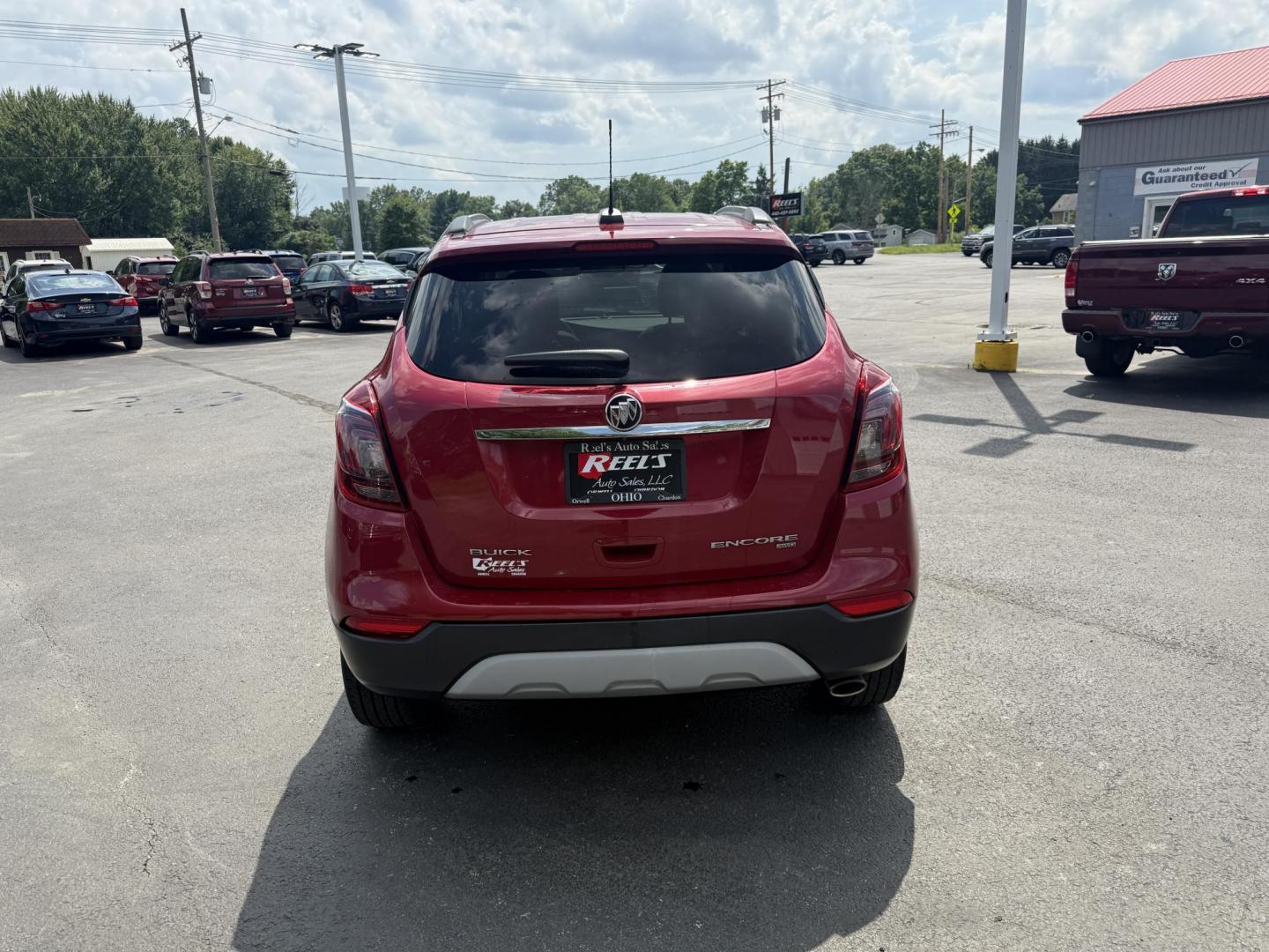 2017 Red /Tan Buick Encore Essence AWD (KL4CJGSBXHB) with an 1.4L I4 DOHC 16V TURBO engine, 6A transmission, located at 547 E. Main St., Orwell, OH, 44076, (440) 437-5893, 41.535435, -80.847855 - This 2017 Buick Encore Essence AWD is a stylish and versatile compact SUV featuring a 1.4-liter turbocharged I4 EcoTec engine paired with a smooth 6-speed automatic transmission, offering a commendable 31 MPG on the highway. Its luxurious leather interior, power driver’s seat, and an 8.0-inch touc - Photo#8