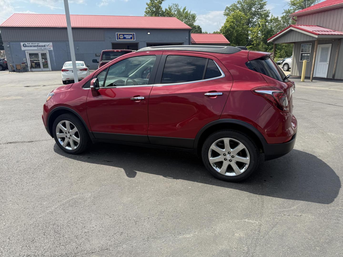 2017 Red /Tan Buick Encore Essence AWD (KL4CJGSBXHB) with an 1.4L I4 DOHC 16V TURBO engine, 6A transmission, located at 547 E. Main St., Orwell, OH, 44076, (440) 437-5893, 41.535435, -80.847855 - This 2017 Buick Encore Essence AWD is a stylish and versatile compact SUV featuring a 1.4-liter turbocharged I4 EcoTec engine paired with a smooth 6-speed automatic transmission, offering a commendable 31 MPG on the highway. Its luxurious leather interior, power driver’s seat, and an 8.0-inch touc - Photo#10
