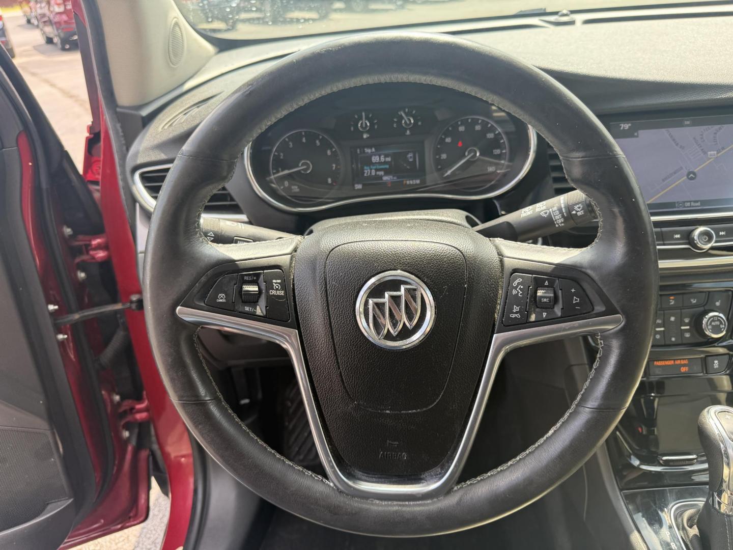 2017 Red /Tan Buick Encore Essence AWD (KL4CJGSBXHB) with an 1.4L I4 DOHC 16V TURBO engine, 6A transmission, located at 547 E. Main St., Orwell, OH, 44076, (440) 437-5893, 41.535435, -80.847855 - This 2017 Buick Encore Essence AWD is a stylish and versatile compact SUV featuring a 1.4-liter turbocharged I4 EcoTec engine paired with a smooth 6-speed automatic transmission, offering a commendable 31 MPG on the highway. Its luxurious leather interior, power driver’s seat, and an 8.0-inch touc - Photo#23