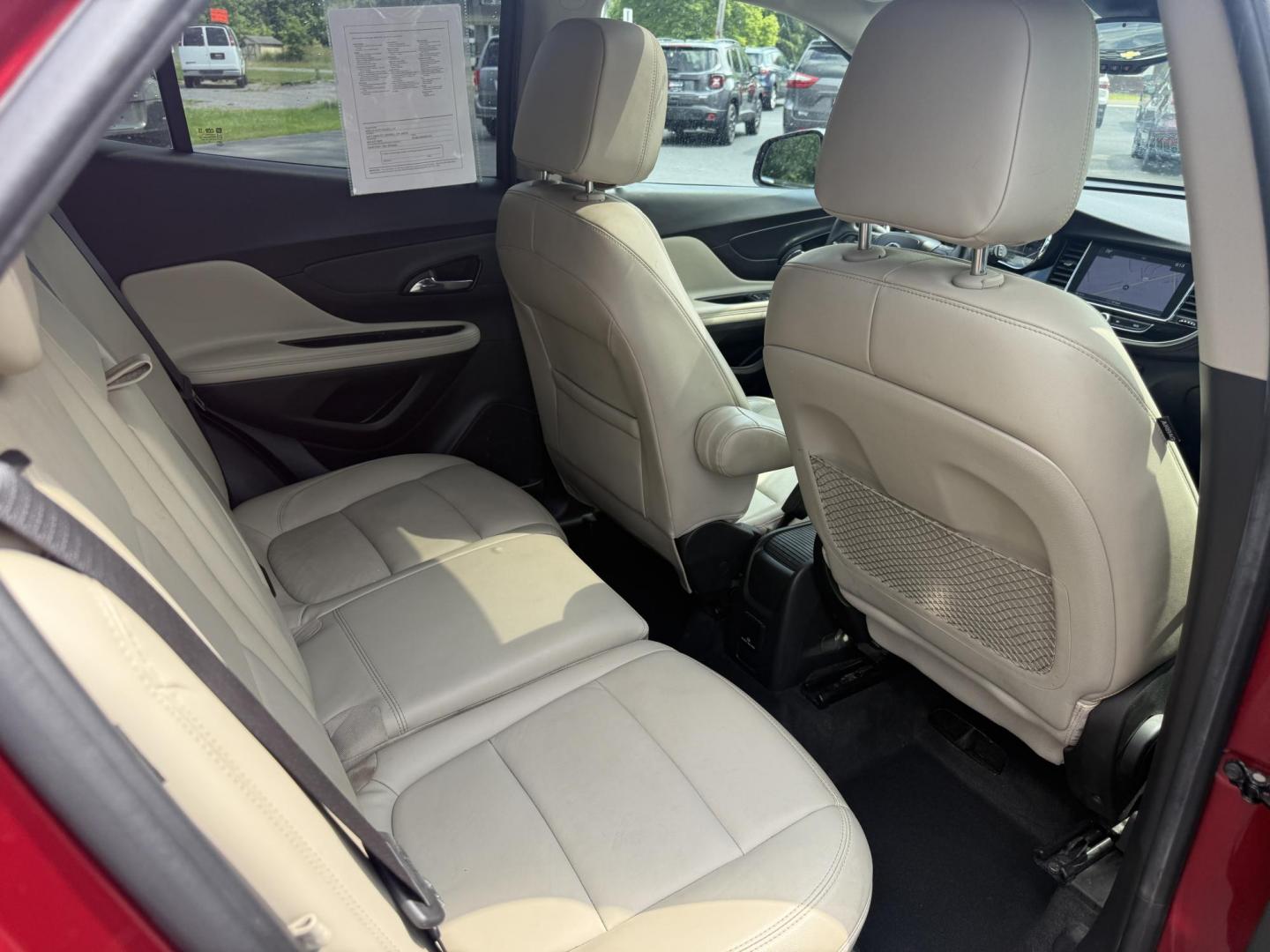 2017 Red /Tan Buick Encore Essence AWD (KL4CJGSBXHB) with an 1.4L I4 DOHC 16V TURBO engine, 6A transmission, located at 547 E. Main St., Orwell, OH, 44076, (440) 437-5893, 41.535435, -80.847855 - This 2017 Buick Encore Essence AWD is a stylish and versatile compact SUV featuring a 1.4-liter turbocharged I4 EcoTec engine paired with a smooth 6-speed automatic transmission, offering a commendable 31 MPG on the highway. Its luxurious leather interior, power driver’s seat, and an 8.0-inch touc - Photo#37