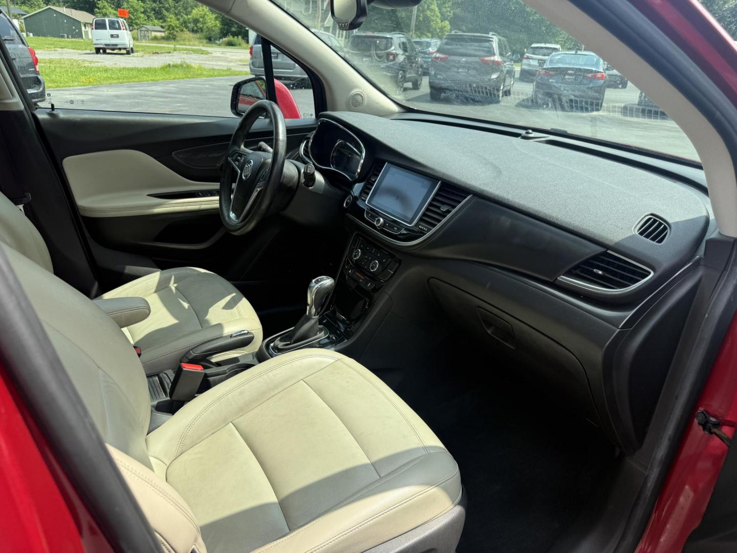 2017 Red /Tan Buick Encore Essence AWD (KL4CJGSBXHB) with an 1.4L I4 DOHC 16V TURBO engine, 6A transmission, located at 547 E. Main St., Orwell, OH, 44076, (440) 437-5893, 41.535435, -80.847855 - This 2017 Buick Encore Essence AWD is a stylish and versatile compact SUV featuring a 1.4-liter turbocharged I4 EcoTec engine paired with a smooth 6-speed automatic transmission, offering a commendable 31 MPG on the highway. Its luxurious leather interior, power driver’s seat, and an 8.0-inch touc - Photo#39