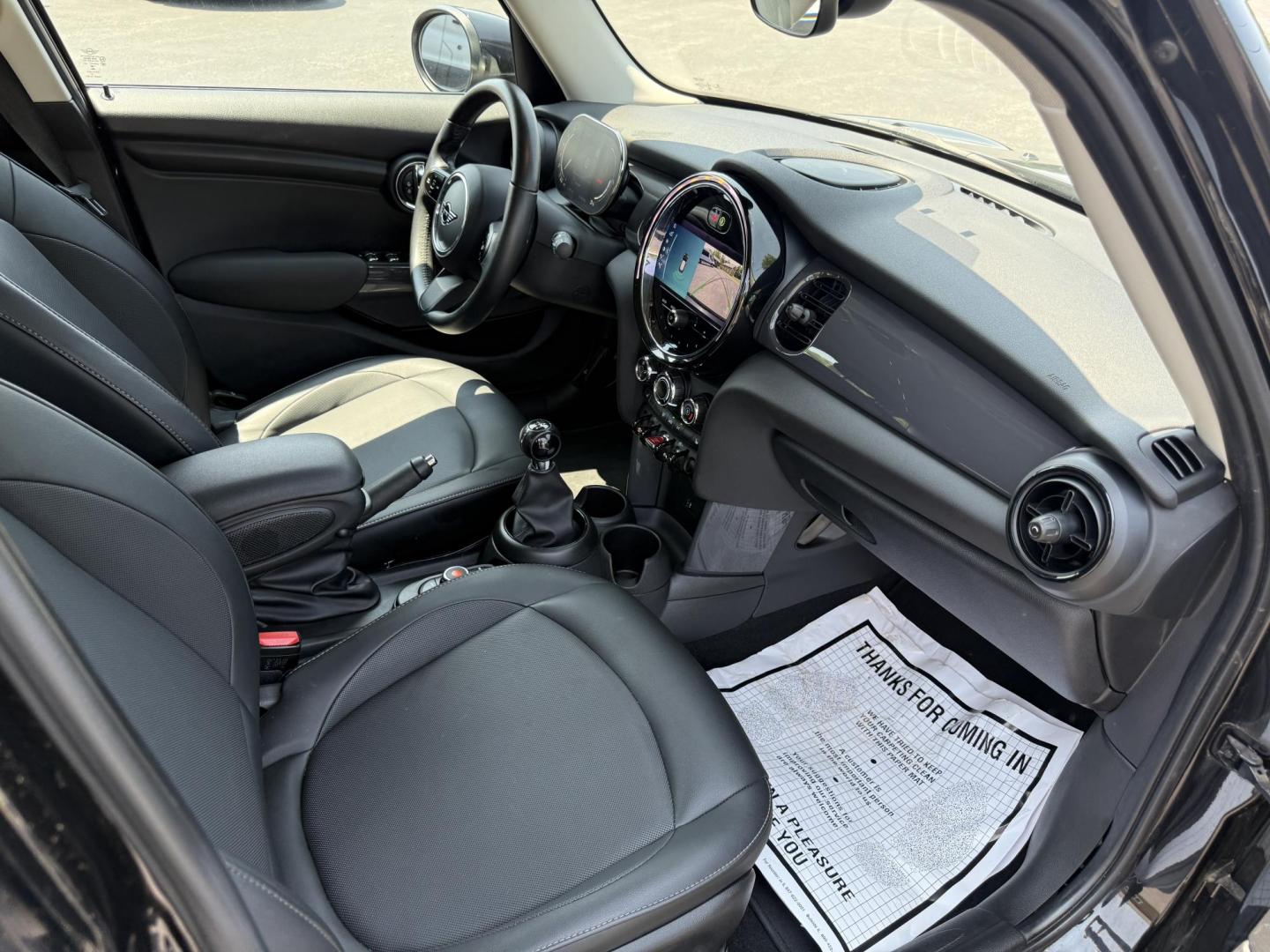 2022 Black /Black Mini Hardtop Cooper 4 Door (WMW33DK02N2) with an 1.5L I3 DOHC 12V TURBO engine, 6 Speed Manual transmission, located at 11115 Chardon Rd. , Chardon, OH, 44024, (440) 214-9705, 41.580246, -81.241943 - This One Owner 2022 Mini Cooper Hardtop 4 Door with a 1.5-liter turbocharged I3 engine and 6-speed manual transmission offers a fun, sporty driving experience combined with practical features like full LED exterior lighting, Apple CarPlay, Android Auto, and a backup camera. It delivers impressive fu - Photo#26