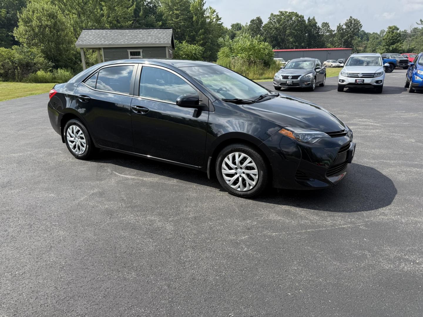 2017 Black /Gray Toyota Corolla LE CVT (2T1BURHE5HC) with an 1.8L I4 DOHC 16V engine, Automatic transmission, located at 11115 Chardon Rd. , Chardon, OH, 44024, (440) 214-9705, 41.580246, -81.241943 - This 2017 Toyota Corolla LE offers a reliable and efficient drive with its 1.8L I4 engine, achieving up to 36 MPG on the highway. Key features include advanced safety tech like lane departure warning, forward collision warning, and adaptive cruise control, as well as eight standard airbags and a bac - Photo#3