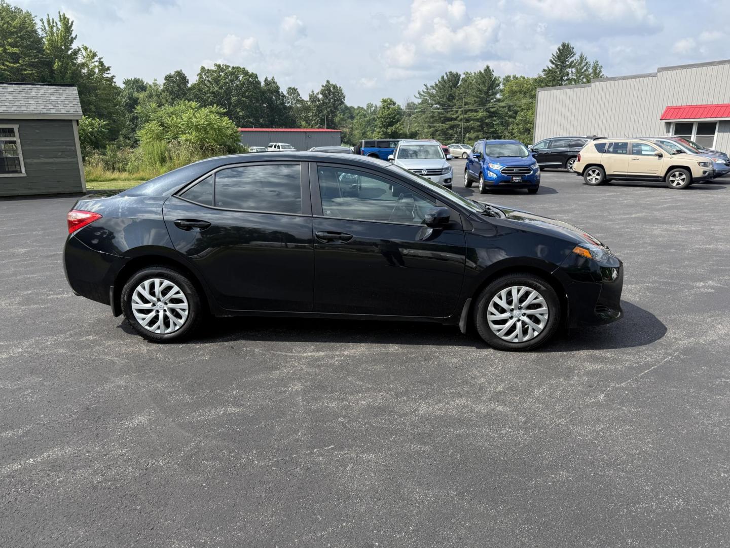 2017 Black /Gray Toyota Corolla LE CVT (2T1BURHE5HC) with an 1.8L I4 DOHC 16V engine, Automatic transmission, located at 11115 Chardon Rd. , Chardon, OH, 44024, (440) 214-9705, 41.580246, -81.241943 - This 2017 Toyota Corolla LE offers a reliable and efficient drive with its 1.8L I4 engine, achieving up to 36 MPG on the highway. Key features include advanced safety tech like lane departure warning, forward collision warning, and adaptive cruise control, as well as eight standard airbags and a bac - Photo#5