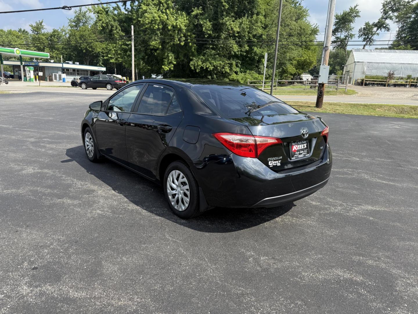 2017 Black /Gray Toyota Corolla LE CVT (2T1BURHE5HC) with an 1.8L I4 DOHC 16V engine, Automatic transmission, located at 11115 Chardon Rd. , Chardon, OH, 44024, (440) 214-9705, 41.580246, -81.241943 - This 2017 Toyota Corolla LE offers a reliable and efficient drive with its 1.8L I4 engine, achieving up to 36 MPG on the highway. Key features include advanced safety tech like lane departure warning, forward collision warning, and adaptive cruise control, as well as eight standard airbags and a bac - Photo#8