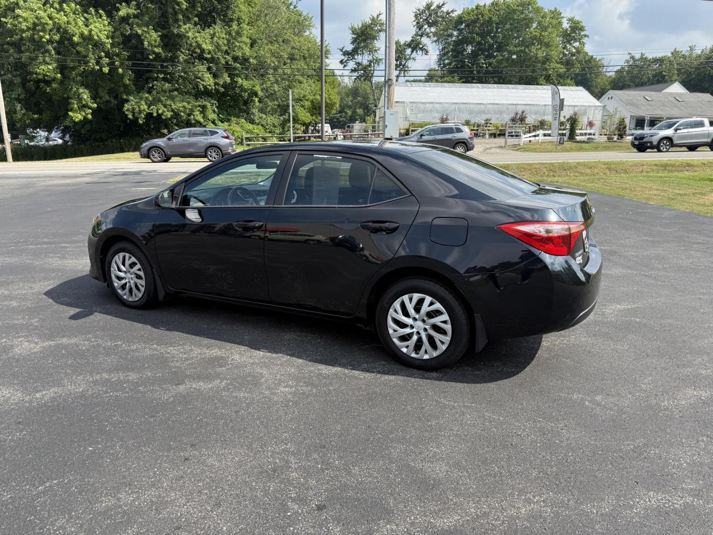 2017 Black /Gray Toyota Corolla LE CVT (2T1BURHE5HC) with an 1.8L I4 DOHC 16V engine, Automatic transmission, located at 11115 Chardon Rd. , Chardon, OH, 44024, (440) 214-9705, 41.580246, -81.241943 - This 2017 Toyota Corolla LE offers a reliable and efficient drive with its 1.8L I4 engine, achieving up to 36 MPG on the highway. Key features include advanced safety tech like lane departure warning, forward collision warning, and adaptive cruise control, as well as eight standard airbags and a bac - Photo#9
