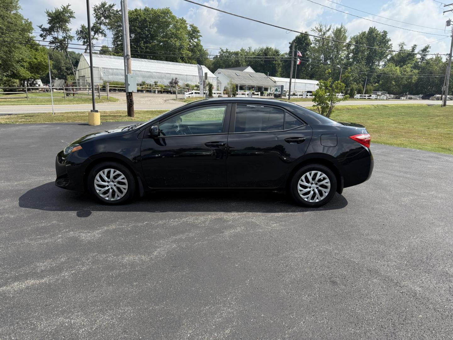 2017 Black /Gray Toyota Corolla LE CVT (2T1BURHE5HC) with an 1.8L I4 DOHC 16V engine, Automatic transmission, located at 11115 Chardon Rd. , Chardon, OH, 44024, (440) 214-9705, 41.580246, -81.241943 - This 2017 Toyota Corolla LE offers a reliable and efficient drive with its 1.8L I4 engine, achieving up to 36 MPG on the highway. Key features include advanced safety tech like lane departure warning, forward collision warning, and adaptive cruise control, as well as eight standard airbags and a bac - Photo#11