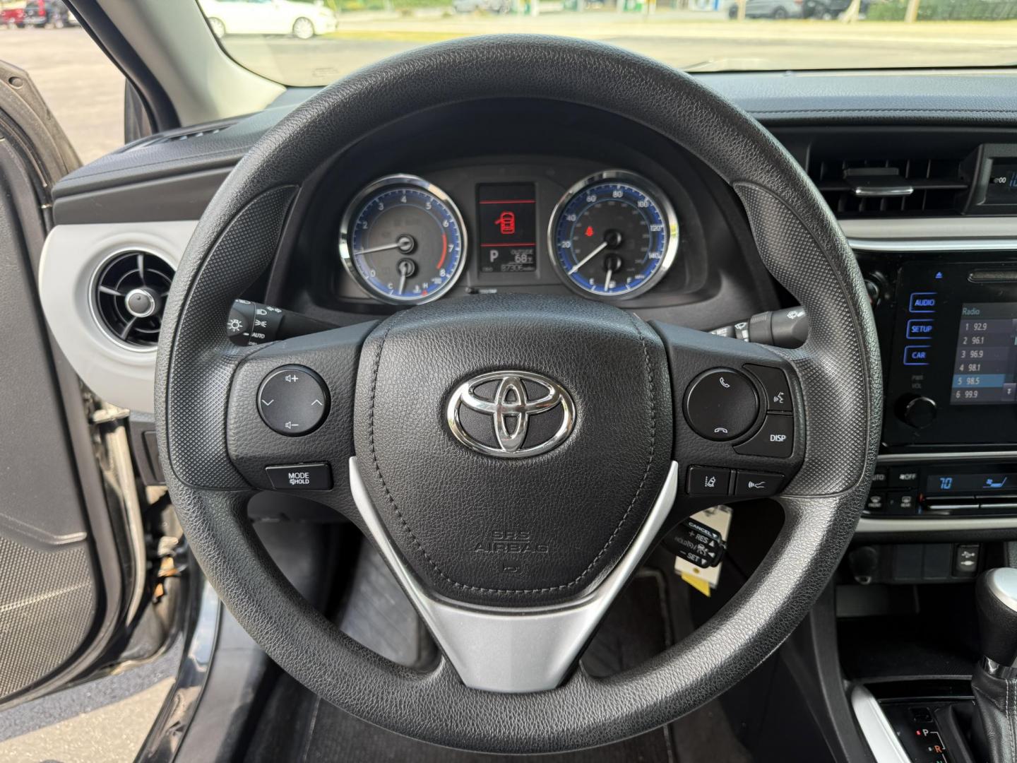 2017 Black /Gray Toyota Corolla LE CVT (2T1BURHE5HC) with an 1.8L I4 DOHC 16V engine, Automatic transmission, located at 11115 Chardon Rd. , Chardon, OH, 44024, (440) 214-9705, 41.580246, -81.241943 - This 2017 Toyota Corolla LE offers a reliable and efficient drive with its 1.8L I4 engine, achieving up to 36 MPG on the highway. Key features include advanced safety tech like lane departure warning, forward collision warning, and adaptive cruise control, as well as eight standard airbags and a bac - Photo#20