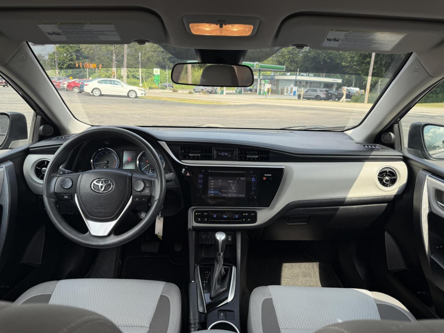 2017 Black /Gray Toyota Corolla LE CVT (2T1BURHE5HC) with an 1.8L I4 DOHC 16V engine, Automatic transmission, located at 11115 Chardon Rd. , Chardon, OH, 44024, (440) 214-9705, 41.580246, -81.241943 - This 2017 Toyota Corolla LE offers a reliable and efficient drive with its 1.8L I4 engine, achieving up to 36 MPG on the highway. Key features include advanced safety tech like lane departure warning, forward collision warning, and adaptive cruise control, as well as eight standard airbags and a bac - Photo#27