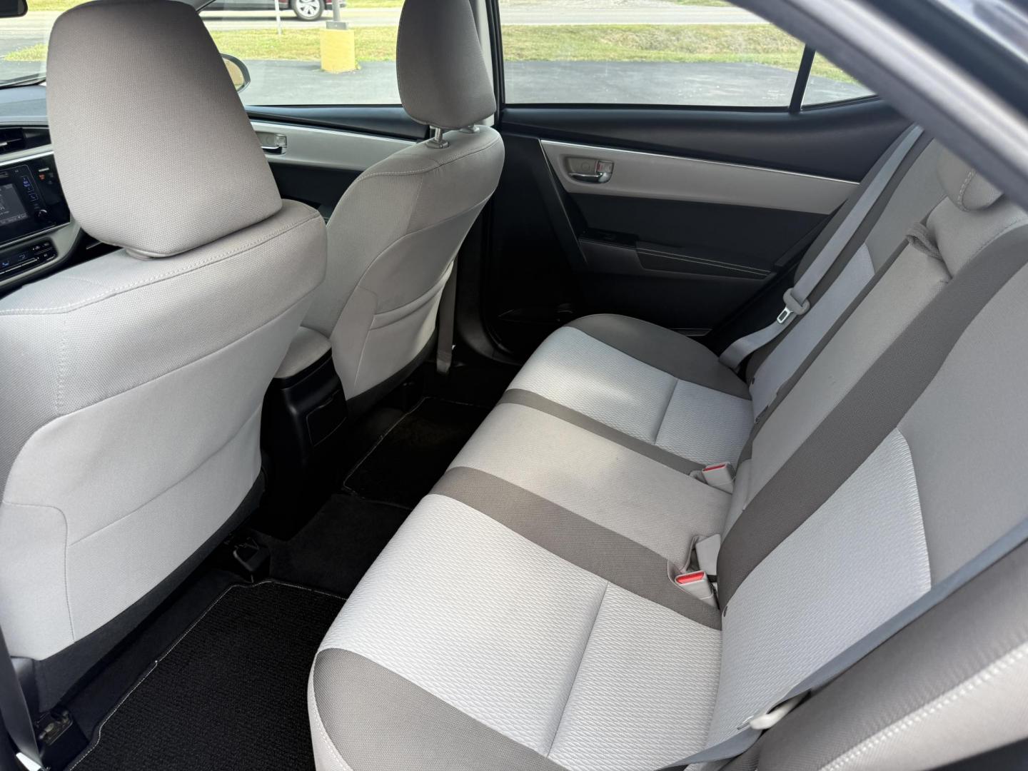 2017 Black /Gray Toyota Corolla LE CVT (2T1BURHE5HC) with an 1.8L I4 DOHC 16V engine, Automatic transmission, located at 11115 Chardon Rd. , Chardon, OH, 44024, (440) 214-9705, 41.580246, -81.241943 - This 2017 Toyota Corolla LE offers a reliable and efficient drive with its 1.8L I4 engine, achieving up to 36 MPG on the highway. Key features include advanced safety tech like lane departure warning, forward collision warning, and adaptive cruise control, as well as eight standard airbags and a bac - Photo#25