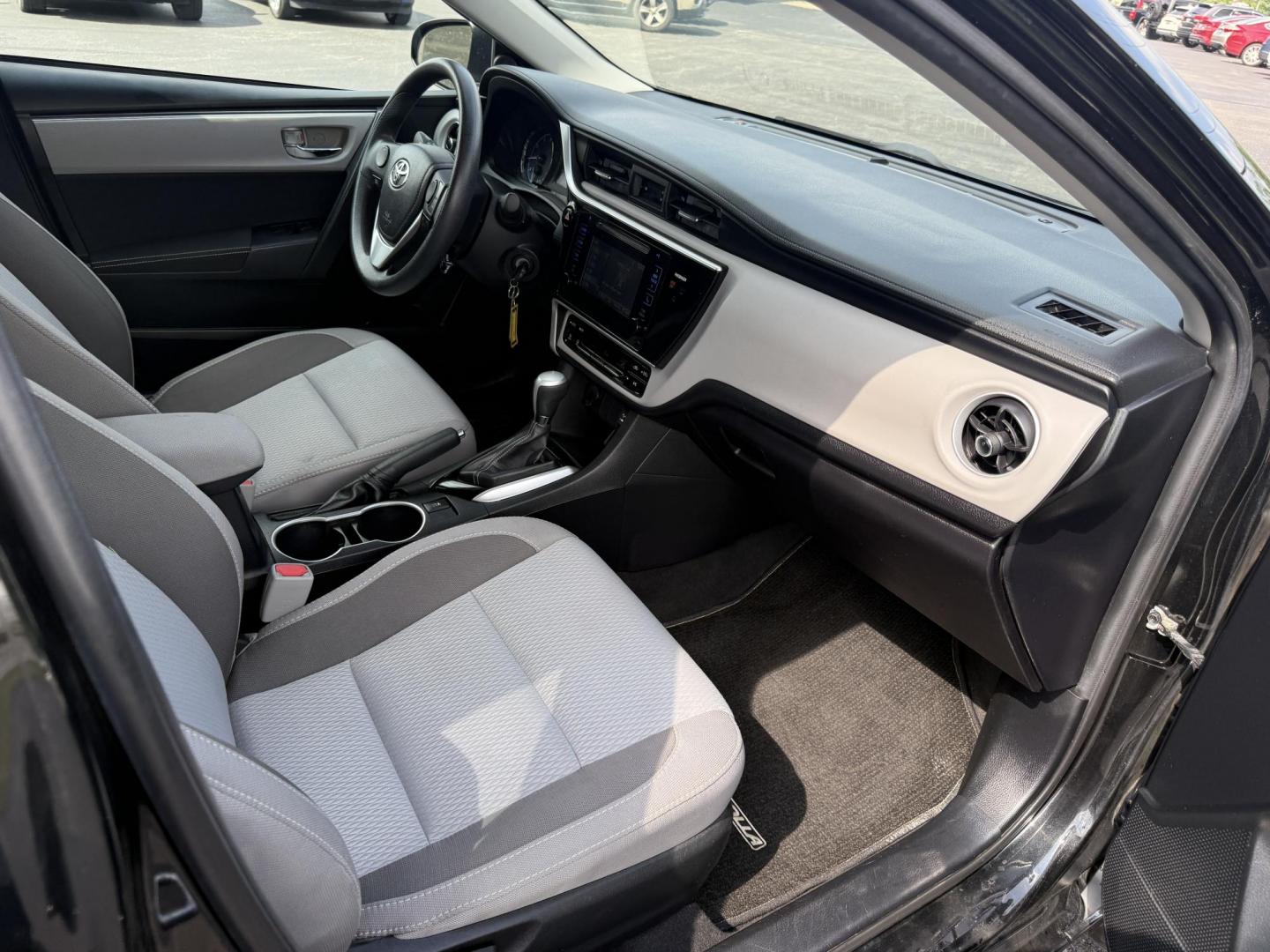 2017 Black /Gray Toyota Corolla LE CVT (2T1BURHE5HC) with an 1.8L I4 DOHC 16V engine, Automatic transmission, located at 11115 Chardon Rd. , Chardon, OH, 44024, (440) 214-9705, 41.580246, -81.241943 - This 2017 Toyota Corolla LE offers a reliable and efficient drive with its 1.8L I4 engine, achieving up to 36 MPG on the highway. Key features include advanced safety tech like lane departure warning, forward collision warning, and adaptive cruise control, as well as eight standard airbags and a bac - Photo#32