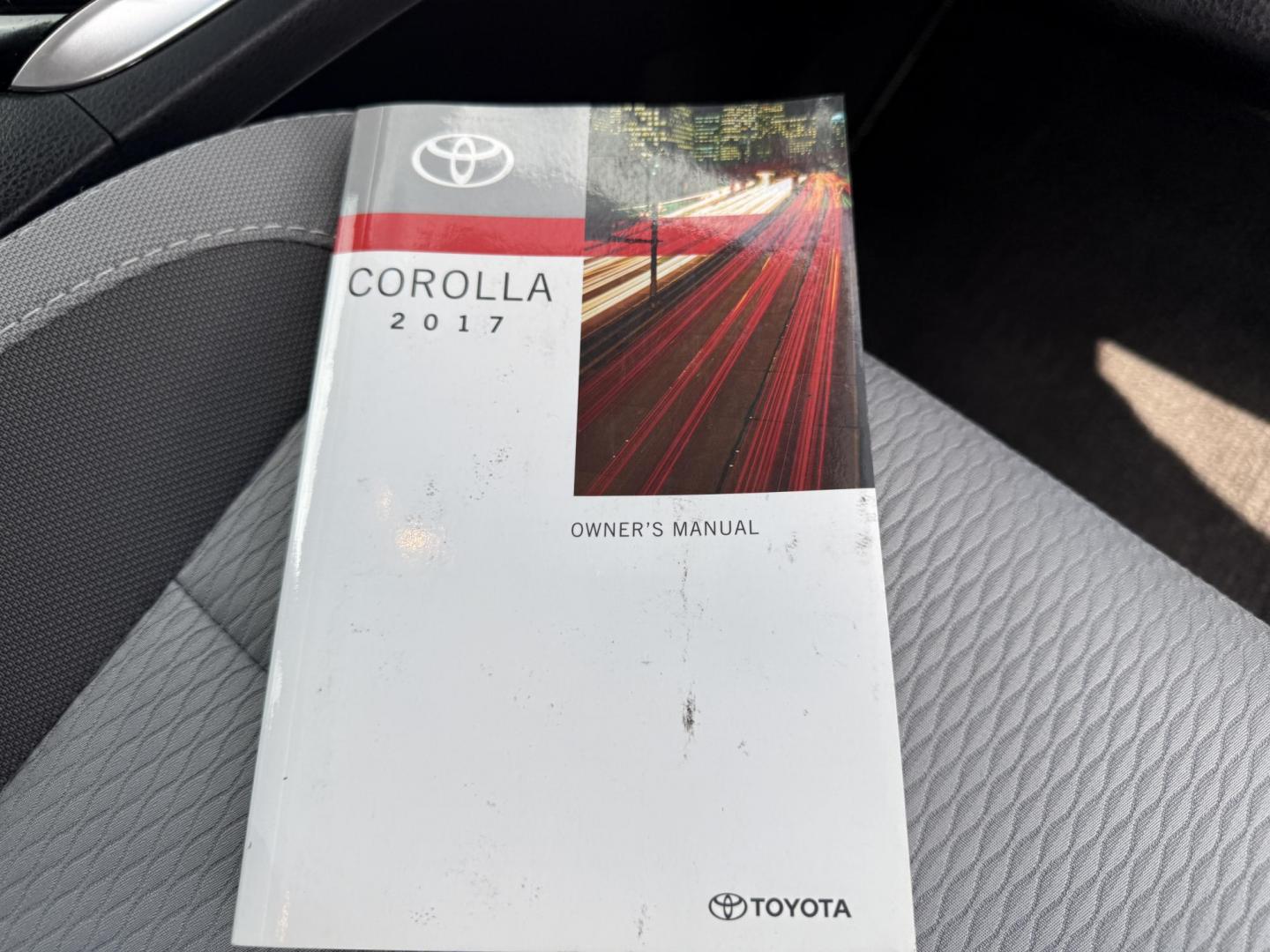2017 Black /Gray Toyota Corolla LE CVT (2T1BURHE5HC) with an 1.8L I4 DOHC 16V engine, Automatic transmission, located at 11115 Chardon Rd. , Chardon, OH, 44024, (440) 214-9705, 41.580246, -81.241943 - This 2017 Toyota Corolla LE offers a reliable and efficient drive with its 1.8L I4 engine, achieving up to 36 MPG on the highway. Key features include advanced safety tech like lane departure warning, forward collision warning, and adaptive cruise control, as well as eight standard airbags and a bac - Photo#33