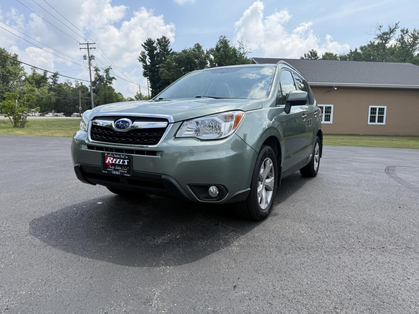 2016 Green /Gray Subaru Forester 2.5i Limited (JF2SJAHC9GH) with an 2.5L H4 DOHC 16V engine, Automatic transmission, located at 11115 Chardon Rd. , Chardon, OH, 44024, (440) 214-9705, 41.580246, -81.241943 - Photo#0