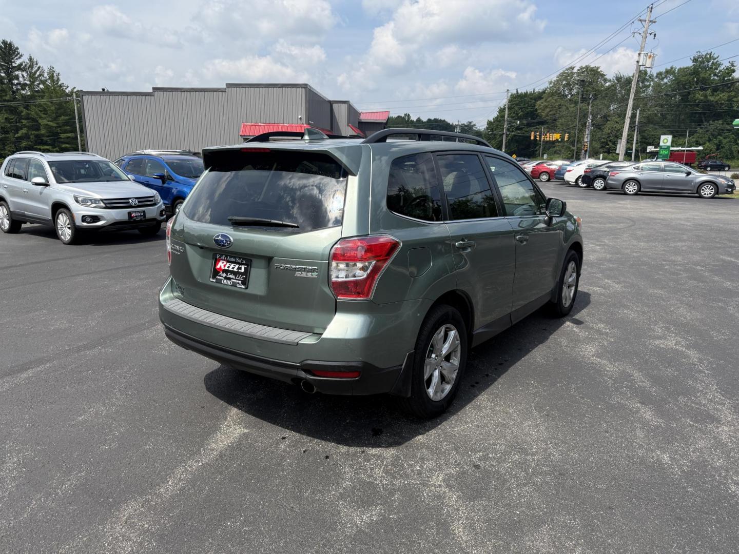 2016 Green /Gray Subaru Forester 2.5i Limited (JF2SJAHC9GH) with an 2.5L H4 DOHC 16V engine, Automatic transmission, located at 11115 Chardon Rd. , Chardon, OH, 44024, (440) 214-9705, 41.580246, -81.241943 - Photo#7