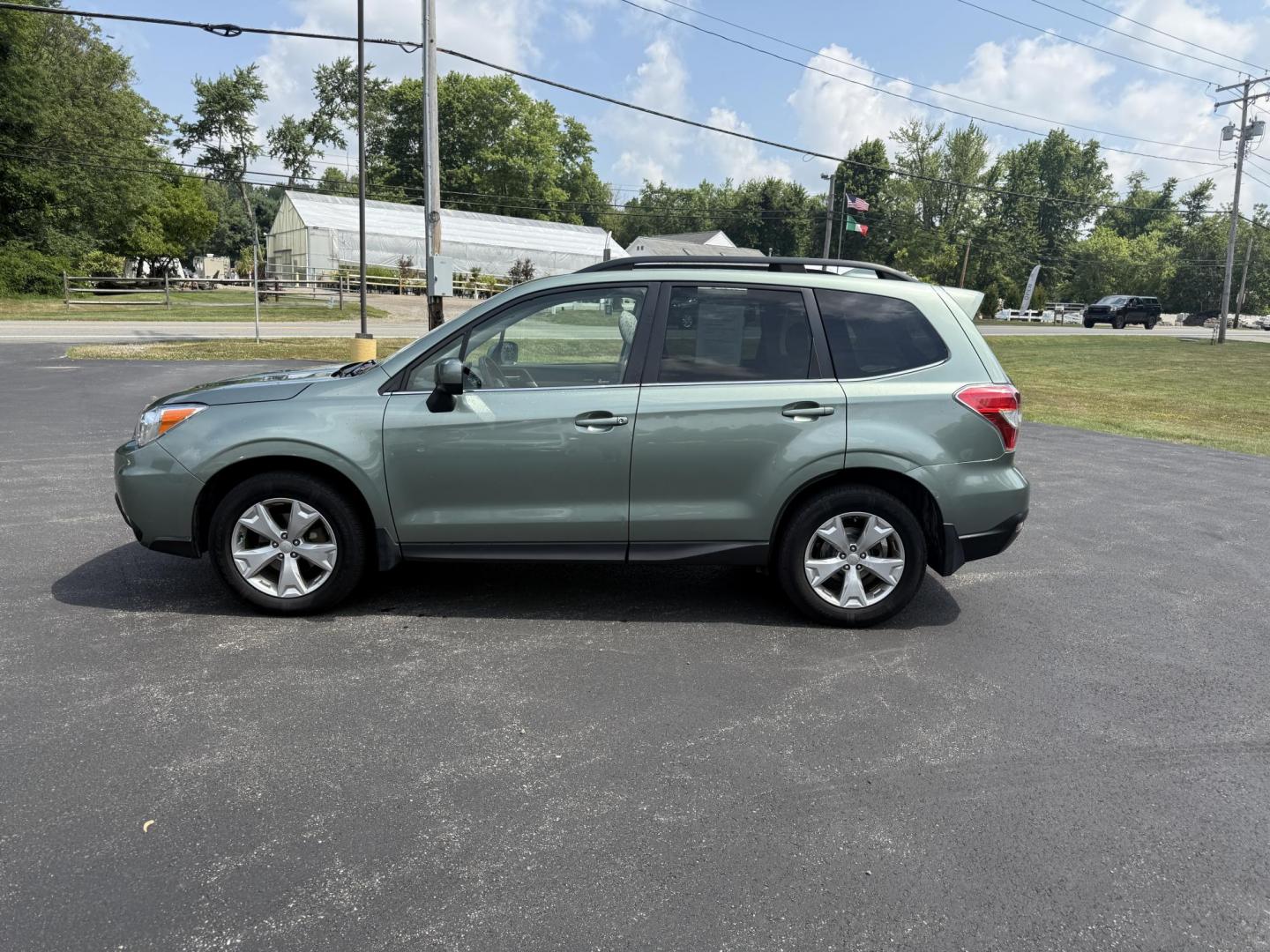 2016 Green /Gray Subaru Forester 2.5i Limited (JF2SJAHC9GH) with an 2.5L H4 DOHC 16V engine, Automatic transmission, located at 11115 Chardon Rd. , Chardon, OH, 44024, (440) 214-9705, 41.580246, -81.241943 - Photo#12