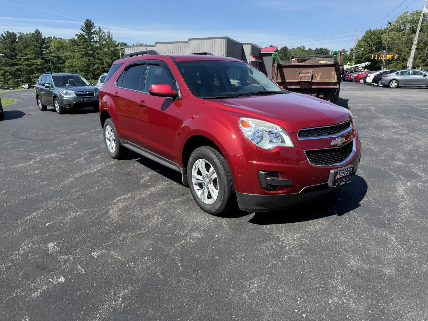 2015 Red /White Chevrolet Equinox 1LT 2WD (2GNALBEK0F6) with an 2.4L I4 DOHC 16V FFV engine, 6-Speed Automatic transmission, located at 11115 Chardon Rd. , Chardon, OH, 44024, (440) 214-9705, 41.580246, -81.241943 - FRESH TRADE ALERT ---- This 2015 Chevrolet Equinox LT 2WD with a 2.4L I4 EcoTec engine and 6-speed automatic transmission offers a solid blend of practicality and comfort, featuring a power driver's seat, daytime running lights, dusk-sensing headlights, remote start, a 7.0-inch touchscreen, and a ba - Photo#2