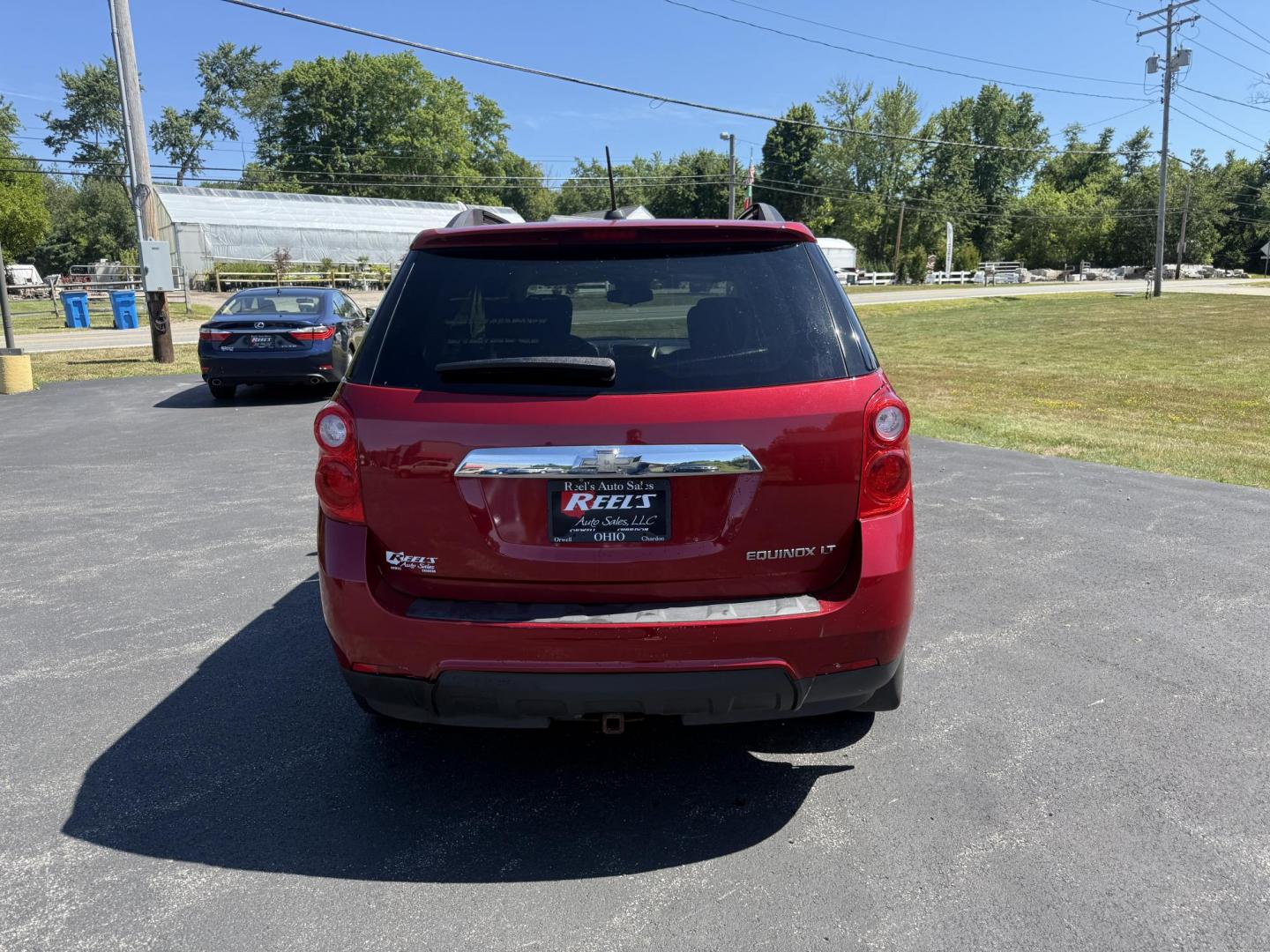 2015 Red /White Chevrolet Equinox 1LT 2WD (2GNALBEK0F6) with an 2.4L I4 DOHC 16V FFV engine, 6-Speed Automatic transmission, located at 11115 Chardon Rd. , Chardon, OH, 44024, (440) 214-9705, 41.580246, -81.241943 - FRESH TRADE ALERT ---- This 2015 Chevrolet Equinox LT 2WD with a 2.4L I4 EcoTec engine and 6-speed automatic transmission offers a solid blend of practicality and comfort, featuring a power driver's seat, daytime running lights, dusk-sensing headlights, remote start, a 7.0-inch touchscreen, and a ba - Photo#8