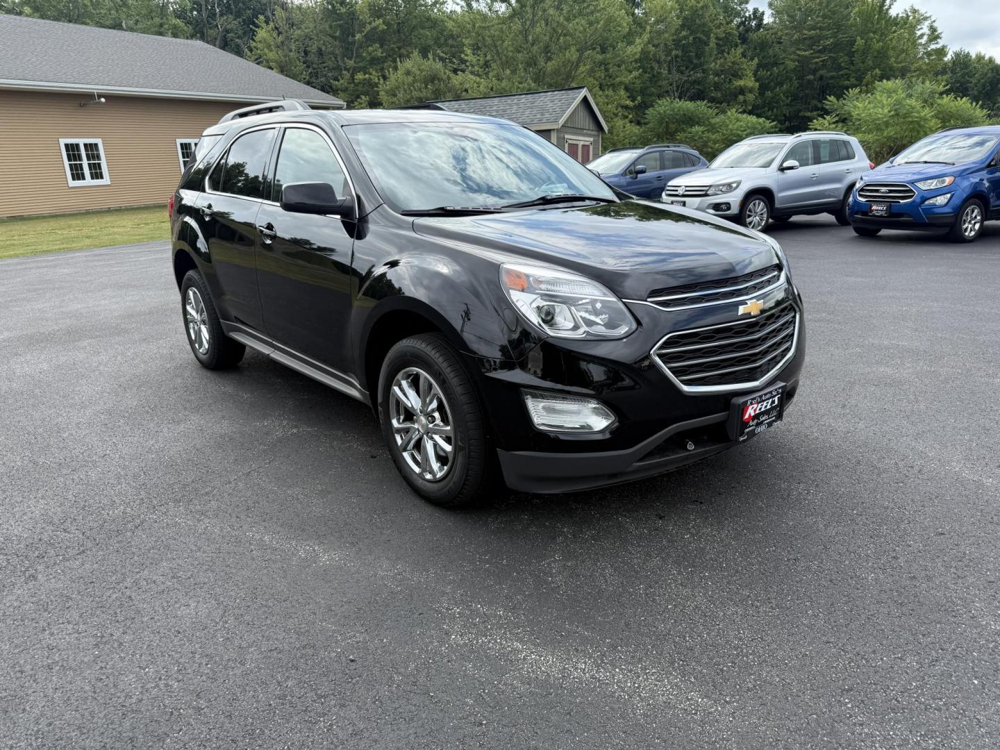 2017 Black /Black Chevrolet Equinox LT AWD (2GNFLFEK8H6) with an 2.4L L4 DOHC 16V FFV engine, 6A transmission, located at 11115 Chardon Rd. , Chardon, OH, 44024, (440) 214-9705, 41.580246, -81.241943 - This 2017 Chevrolet Equinox LT AWD with the 2.4L I4 EcoTec engine offers a reliable and fuel-efficient crossover suited for daily commuting and family use, delivering up to 28 MPG highway. It features a 6-speed automatic transmission, flex-fuel capability, and practical amenities like daytime runnin - Photo#2
