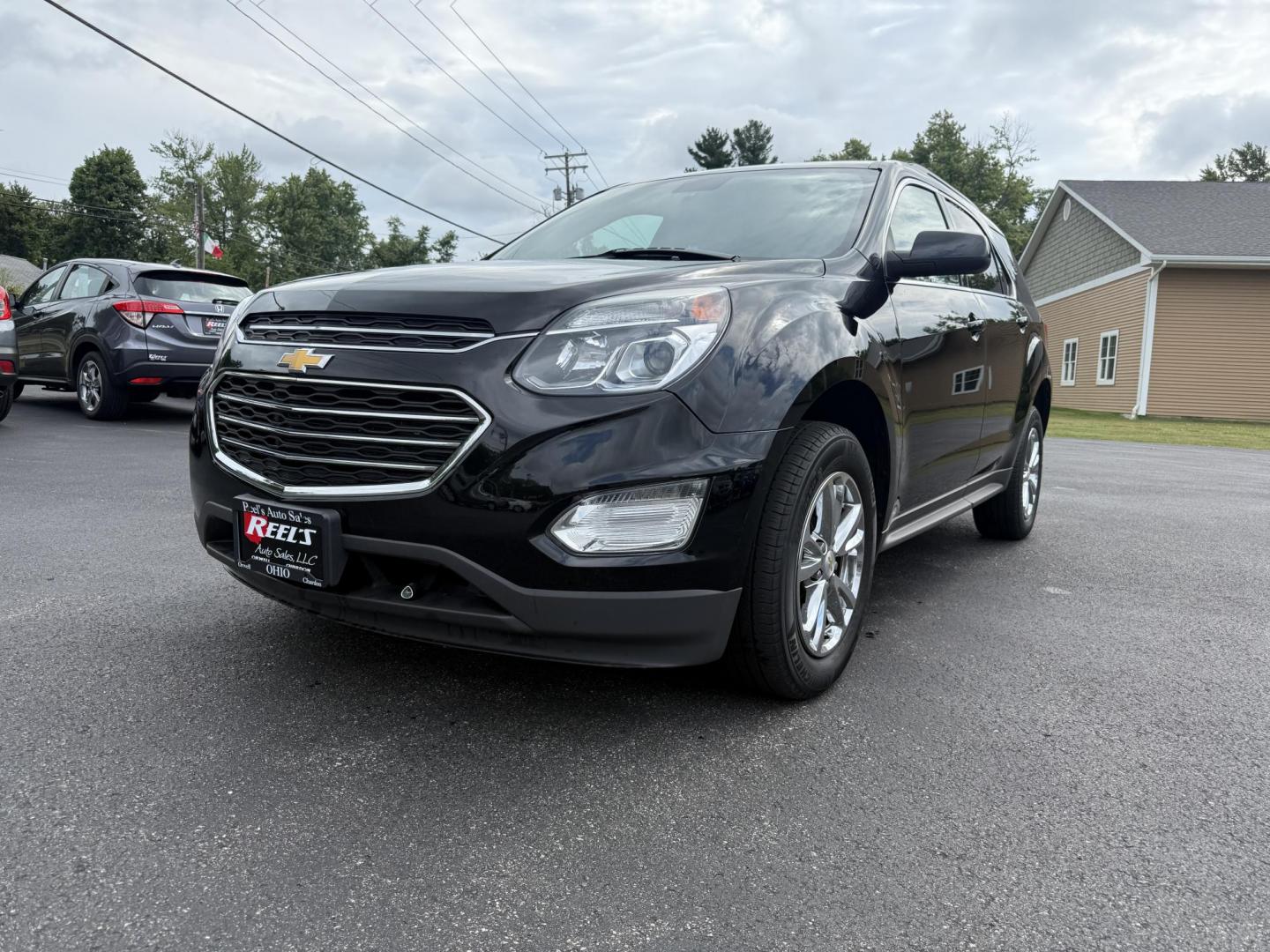 2017 Black /Black Chevrolet Equinox LT AWD (2GNFLFEK8H6) with an 2.4L L4 DOHC 16V FFV engine, 6A transmission, located at 11115 Chardon Rd. , Chardon, OH, 44024, (440) 214-9705, 41.580246, -81.241943 - This 2017 Chevrolet Equinox LT AWD with the 2.4L I4 EcoTec engine offers a reliable and fuel-efficient crossover suited for daily commuting and family use, delivering up to 28 MPG highway. It features a 6-speed automatic transmission, flex-fuel capability, and practical amenities like daytime runnin - Photo#0
