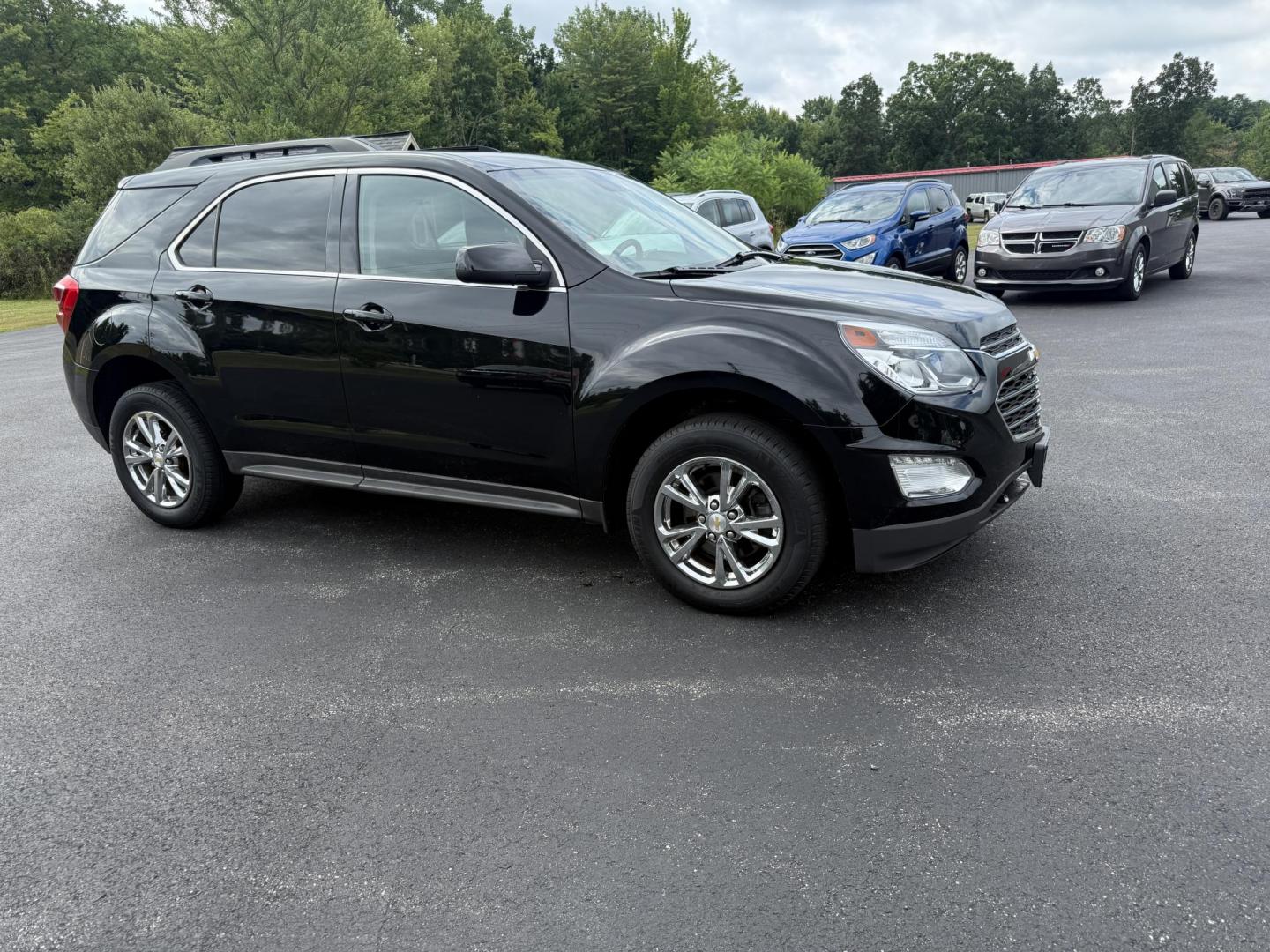 2017 Black /Black Chevrolet Equinox LT AWD (2GNFLFEK8H6) with an 2.4L L4 DOHC 16V FFV engine, 6A transmission, located at 11115 Chardon Rd. , Chardon, OH, 44024, (440) 214-9705, 41.580246, -81.241943 - This 2017 Chevrolet Equinox LT AWD with the 2.4L I4 EcoTec engine offers a reliable and fuel-efficient crossover suited for daily commuting and family use, delivering up to 28 MPG highway. It features a 6-speed automatic transmission, flex-fuel capability, and practical amenities like daytime runnin - Photo#3