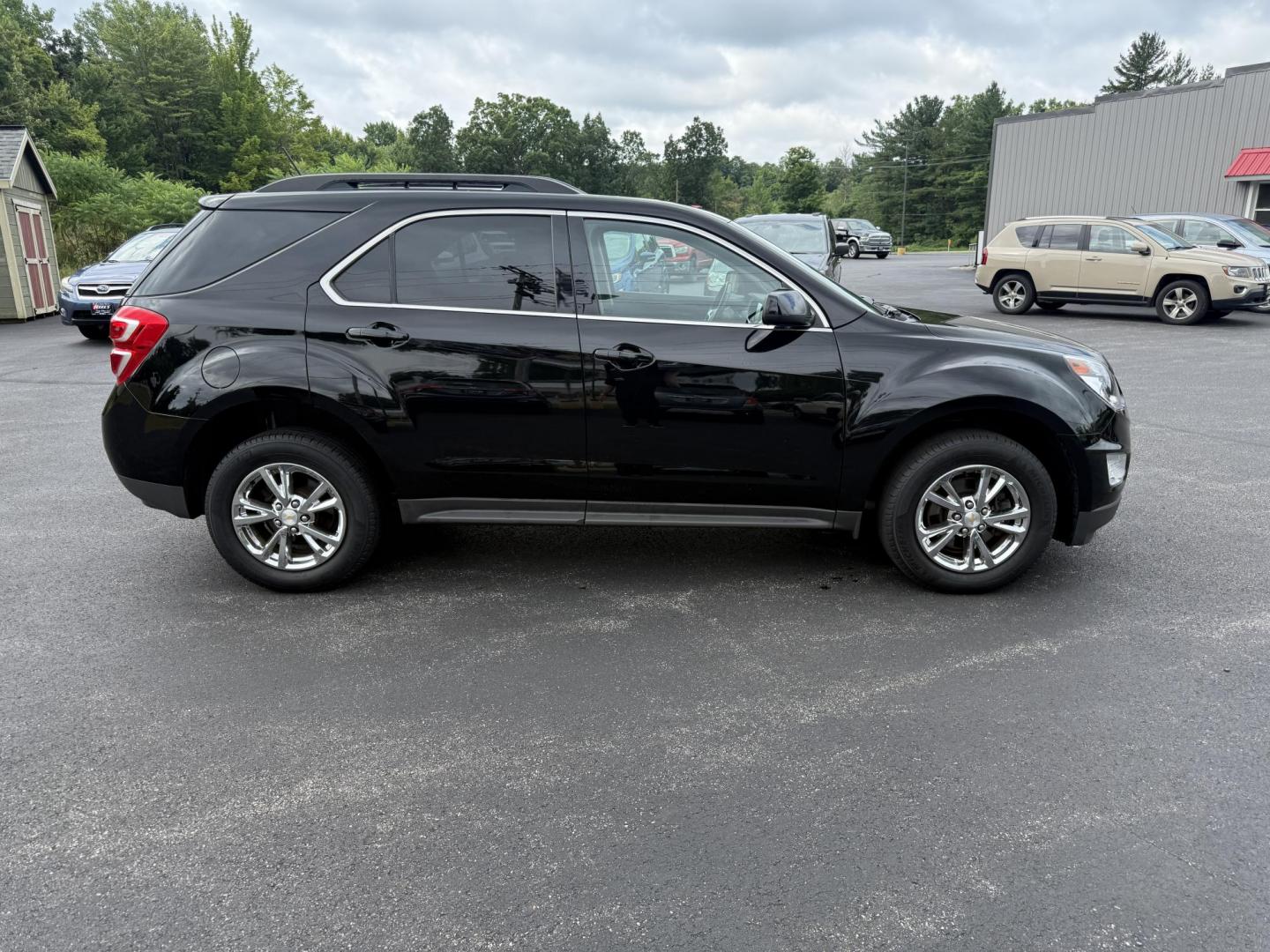 2017 Black /Black Chevrolet Equinox LT AWD (2GNFLFEK8H6) with an 2.4L L4 DOHC 16V FFV engine, 6A transmission, located at 11115 Chardon Rd. , Chardon, OH, 44024, (440) 214-9705, 41.580246, -81.241943 - This 2017 Chevrolet Equinox LT AWD with the 2.4L I4 EcoTec engine offers a reliable and fuel-efficient crossover suited for daily commuting and family use, delivering up to 28 MPG highway. It features a 6-speed automatic transmission, flex-fuel capability, and practical amenities like daytime runnin - Photo#5