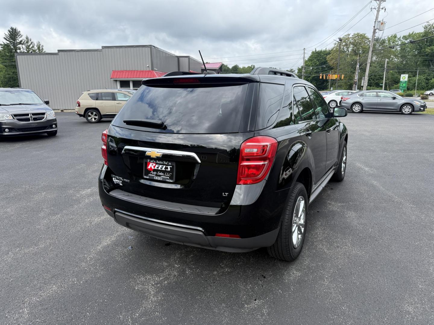 2017 Black /Black Chevrolet Equinox LT AWD (2GNFLFEK8H6) with an 2.4L L4 DOHC 16V FFV engine, 6A transmission, located at 11115 Chardon Rd. , Chardon, OH, 44024, (440) 214-9705, 41.580246, -81.241943 - This 2017 Chevrolet Equinox LT AWD with the 2.4L I4 EcoTec engine offers a reliable and fuel-efficient crossover suited for daily commuting and family use, delivering up to 28 MPG highway. It features a 6-speed automatic transmission, flex-fuel capability, and practical amenities like daytime runnin - Photo#7