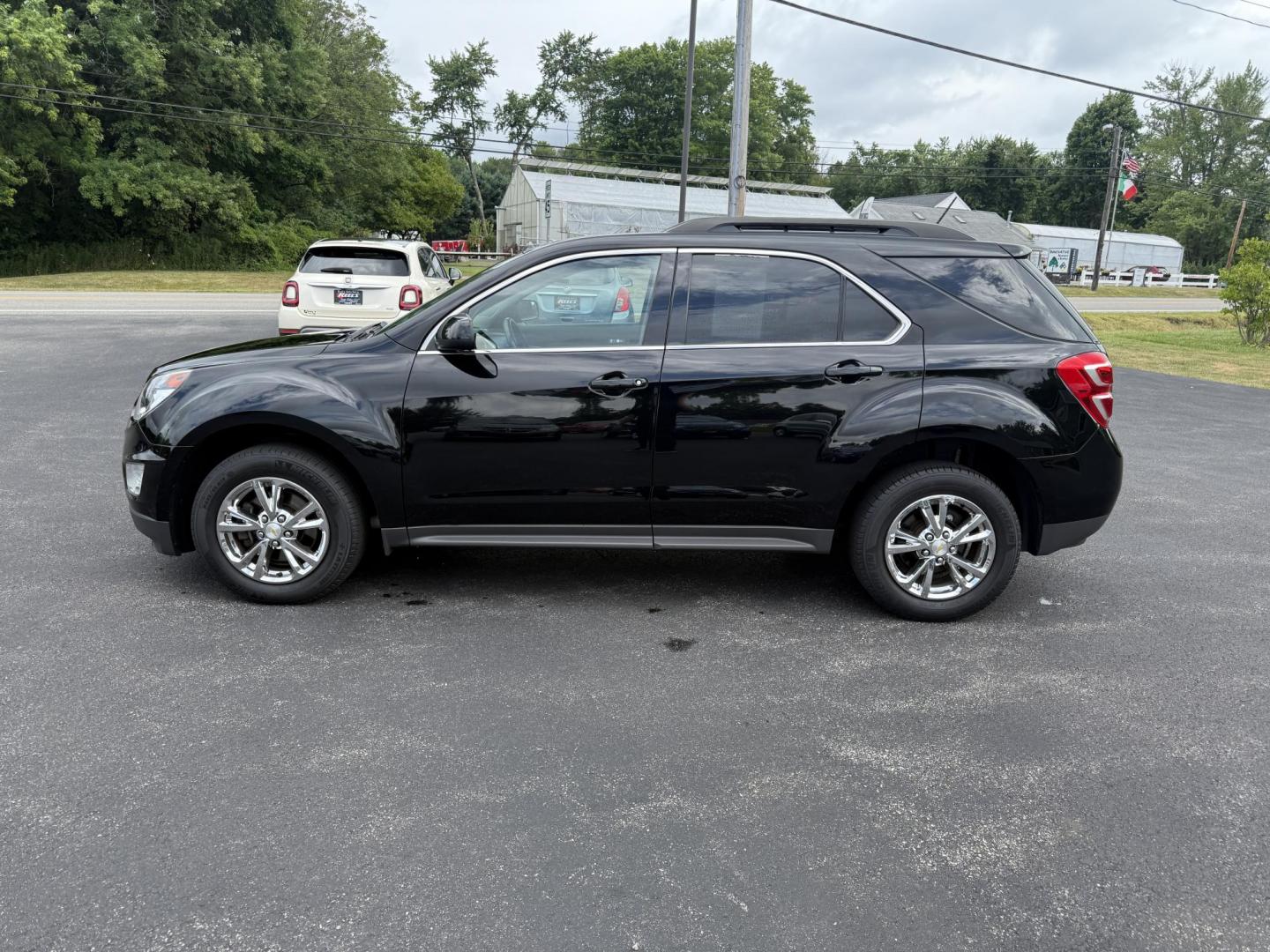 2017 Black /Black Chevrolet Equinox LT AWD (2GNFLFEK8H6) with an 2.4L L4 DOHC 16V FFV engine, 6A transmission, located at 11115 Chardon Rd. , Chardon, OH, 44024, (440) 214-9705, 41.580246, -81.241943 - This 2017 Chevrolet Equinox LT AWD with the 2.4L I4 EcoTec engine offers a reliable and fuel-efficient crossover suited for daily commuting and family use, delivering up to 28 MPG highway. It features a 6-speed automatic transmission, flex-fuel capability, and practical amenities like daytime runnin - Photo#12