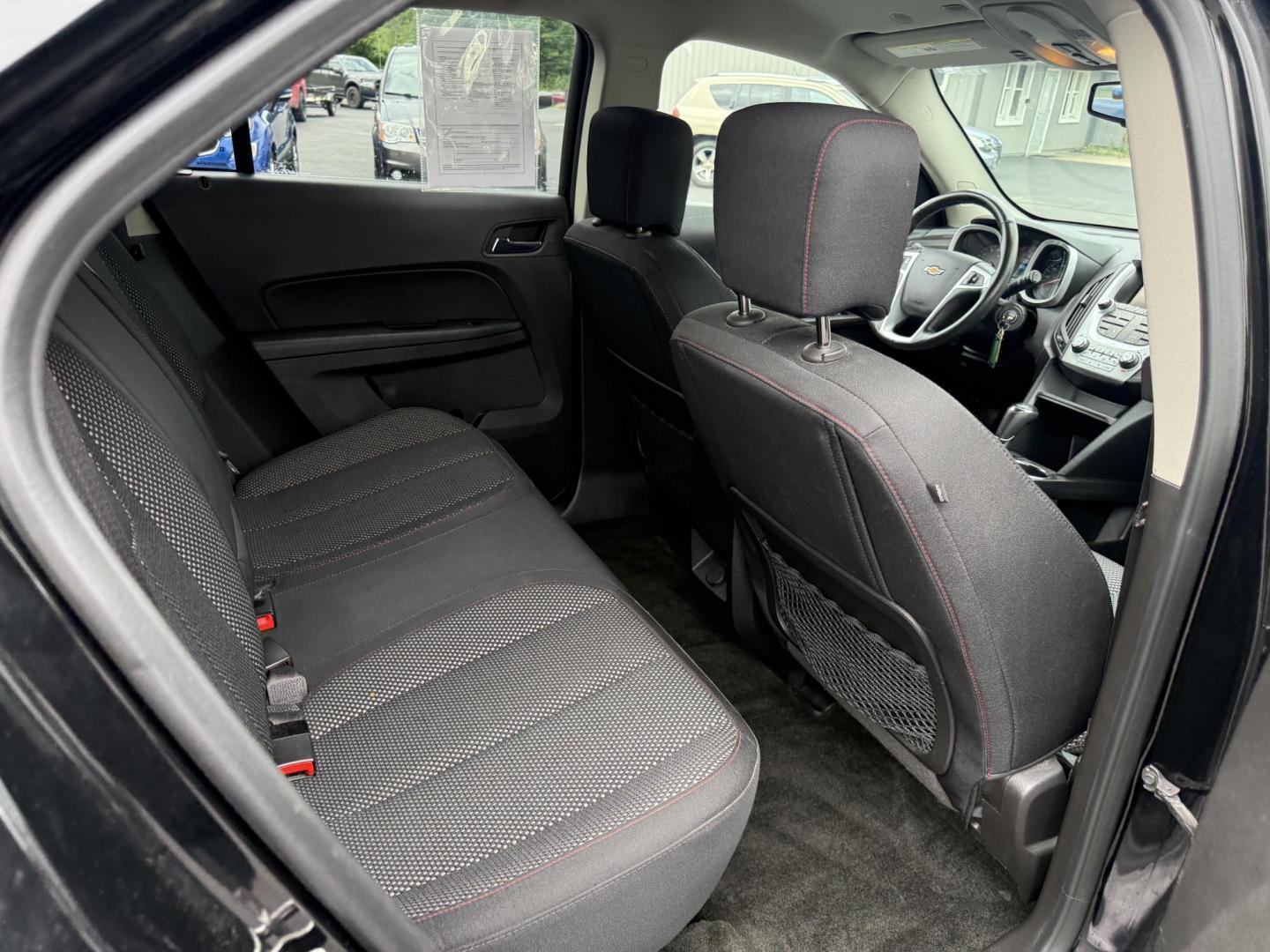 2017 Black /Black Chevrolet Equinox LT AWD (2GNFLFEK8H6) with an 2.4L L4 DOHC 16V FFV engine, 6A transmission, located at 11115 Chardon Rd. , Chardon, OH, 44024, (440) 214-9705, 41.580246, -81.241943 - This 2017 Chevrolet Equinox LT AWD with the 2.4L I4 EcoTec engine offers a reliable and fuel-efficient crossover suited for daily commuting and family use, delivering up to 28 MPG highway. It features a 6-speed automatic transmission, flex-fuel capability, and practical amenities like daytime runnin - Photo#32