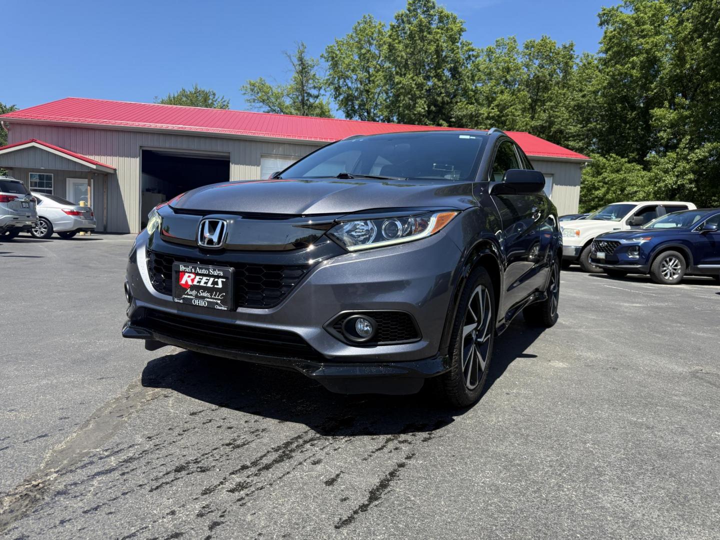 2019 Gray /Black Honda HR-V Sport AWD (3CZRU6H14KG) with an 1.8L I4 DOHC 16V engine, Automatic transmission, located at 547 E. Main St., Orwell, OH, 44076, (440) 437-5893, 41.535435, -80.847855 - This 2019 Honda HR-V Sport AWD offers a versatile and efficient driving experience with its 1.8L I4 engine, sport mode, eco mode, paddle shifters, and an impressive 31 MPG highway fuel economy. It features modern amenities like LED daytime running lights, a 7.0" touchscreen, Apple CarPlay, Android A - Photo#0