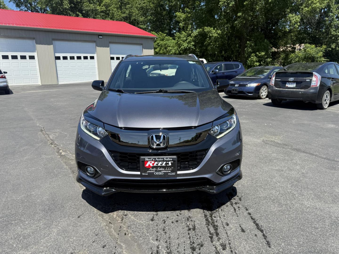 2019 Gray /Black Honda HR-V Sport AWD (3CZRU6H14KG) with an 1.8L I4 DOHC 16V engine, Automatic transmission, located at 547 E. Main St., Orwell, OH, 44076, (440) 437-5893, 41.535435, -80.847855 - This 2019 Honda HR-V Sport AWD offers a versatile and efficient driving experience with its 1.8L I4 engine, sport mode, eco mode, paddle shifters, and an impressive 31 MPG highway fuel economy. It features modern amenities like LED daytime running lights, a 7.0" touchscreen, Apple CarPlay, Android A - Photo#1