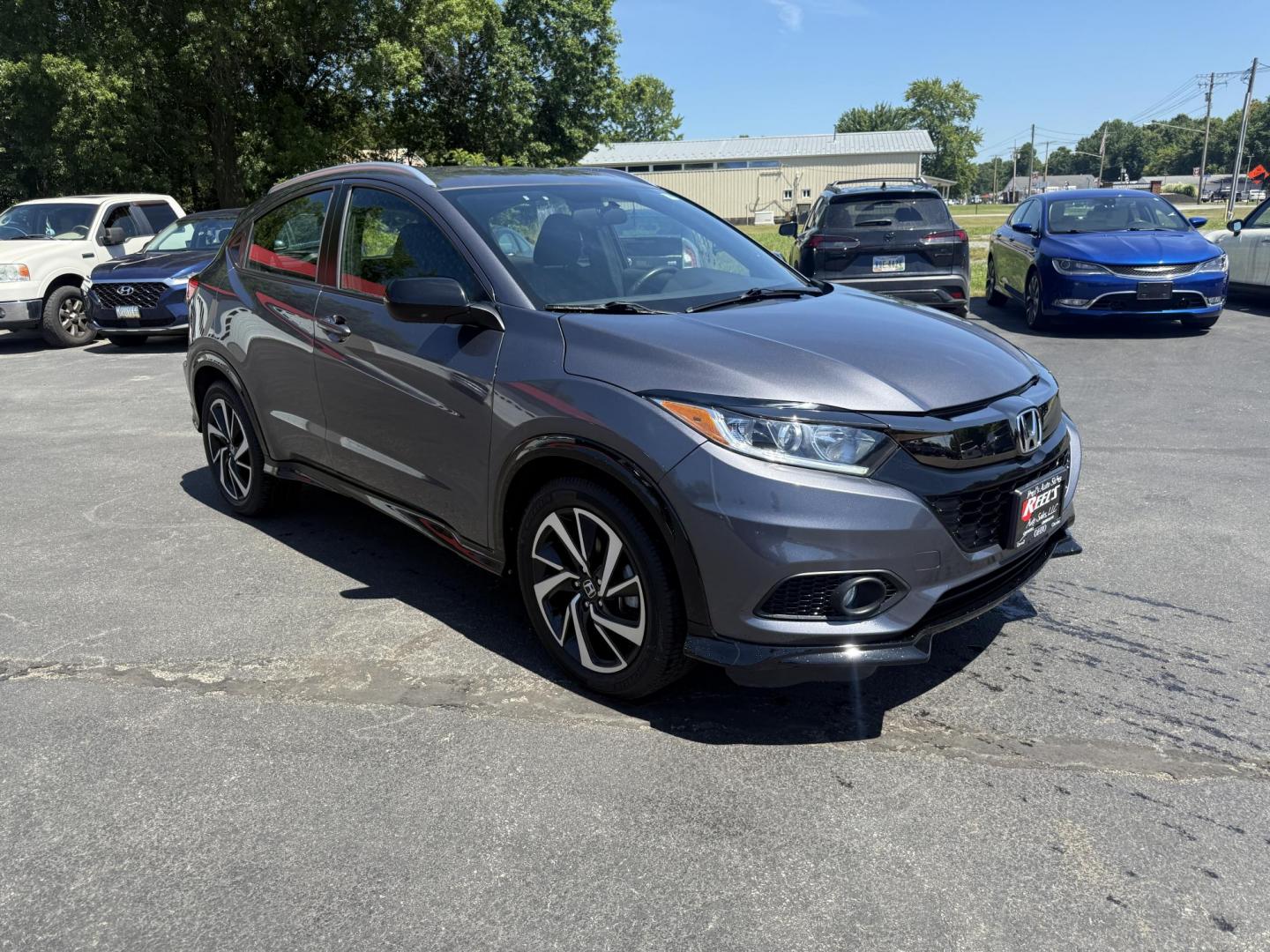 2019 Gray /Black Honda HR-V Sport AWD (3CZRU6H14KG) with an 1.8L I4 DOHC 16V engine, Automatic transmission, located at 547 E. Main St., Orwell, OH, 44076, (440) 437-5893, 41.535435, -80.847855 - This 2019 Honda HR-V Sport AWD offers a versatile and efficient driving experience with its 1.8L I4 engine, sport mode, eco mode, paddle shifters, and an impressive 31 MPG highway fuel economy. It features modern amenities like LED daytime running lights, a 7.0" touchscreen, Apple CarPlay, Android A - Photo#2