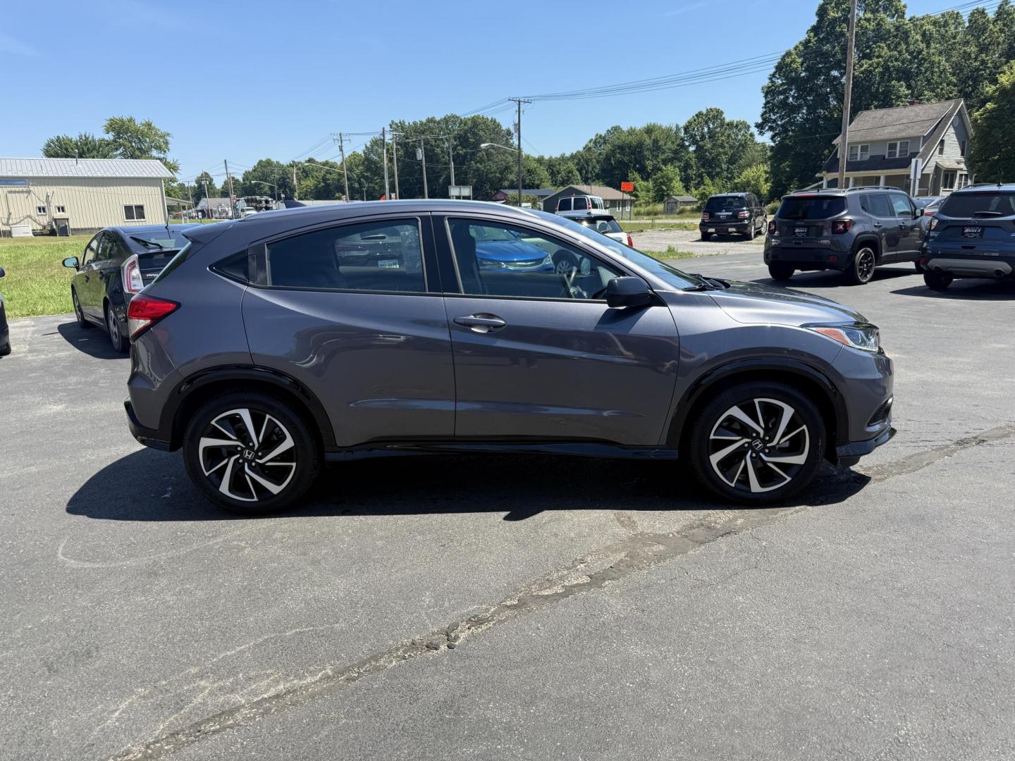 2019 Gray /Black Honda HR-V Sport AWD (3CZRU6H14KG) with an 1.8L I4 DOHC 16V engine, Automatic transmission, located at 547 E. Main St., Orwell, OH, 44076, (440) 437-5893, 41.535435, -80.847855 - This 2019 Honda HR-V Sport AWD offers a versatile and efficient driving experience with its 1.8L I4 engine, sport mode, eco mode, paddle shifters, and an impressive 31 MPG highway fuel economy. It features modern amenities like LED daytime running lights, a 7.0" touchscreen, Apple CarPlay, Android A - Photo#5