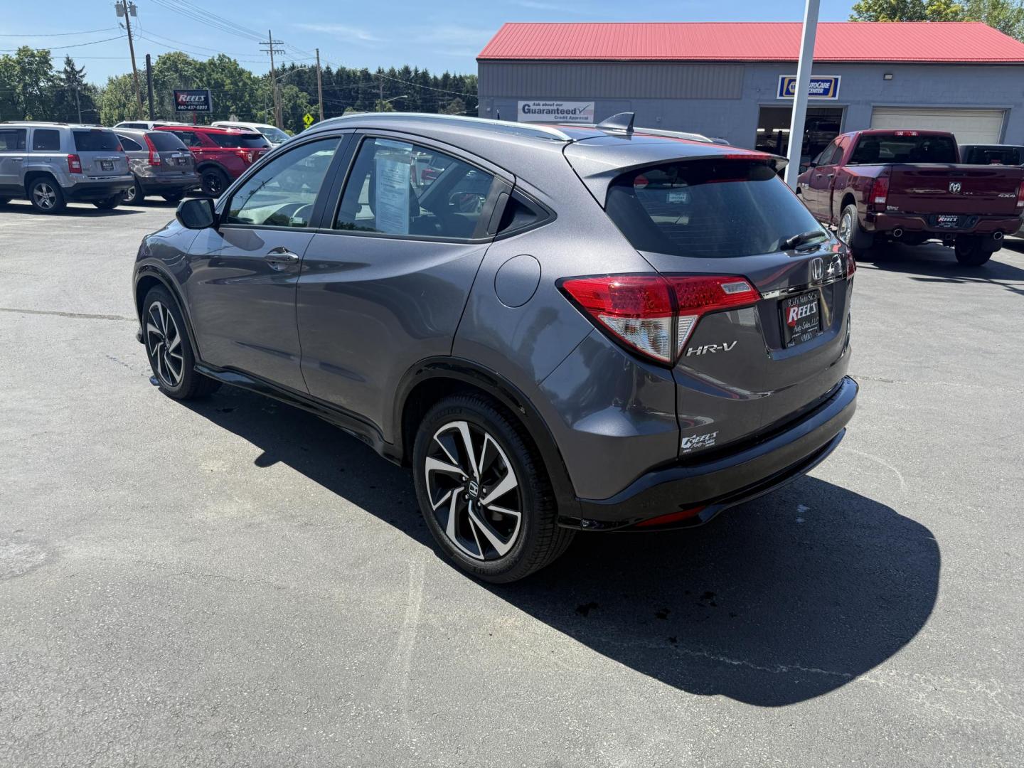2019 Gray /Black Honda HR-V Sport AWD (3CZRU6H14KG) with an 1.8L I4 DOHC 16V engine, Automatic transmission, located at 547 E. Main St., Orwell, OH, 44076, (440) 437-5893, 41.535435, -80.847855 - This 2019 Honda HR-V Sport AWD offers a versatile and efficient driving experience with its 1.8L I4 engine, sport mode, eco mode, paddle shifters, and an impressive 31 MPG highway fuel economy. It features modern amenities like LED daytime running lights, a 7.0" touchscreen, Apple CarPlay, Android A - Photo#9