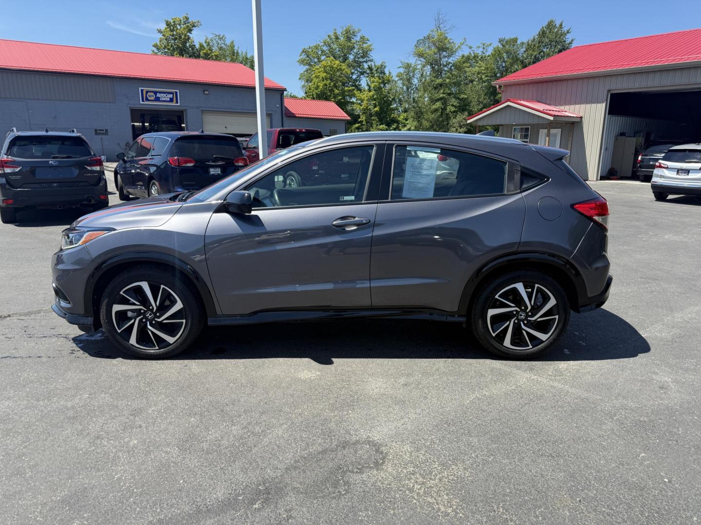 2019 Gray /Black Honda HR-V Sport AWD (3CZRU6H14KG) with an 1.8L I4 DOHC 16V engine, Automatic transmission, located at 547 E. Main St., Orwell, OH, 44076, (440) 437-5893, 41.535435, -80.847855 - This 2019 Honda HR-V Sport AWD offers a versatile and efficient driving experience with its 1.8L I4 engine, sport mode, eco mode, paddle shifters, and an impressive 31 MPG highway fuel economy. It features modern amenities like LED daytime running lights, a 7.0" touchscreen, Apple CarPlay, Android A - Photo#12