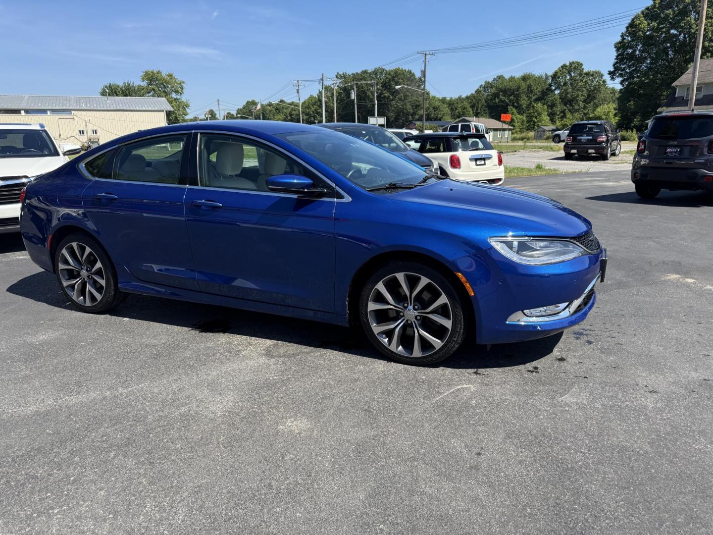 2015 Blue /White Chrysler 200 C (1C3CCCCG2FN) with an 3.6L V6 DOHC 24V engine, 9-Speed Automatic transmission, located at 547 E. Main St., Orwell, OH, 44076, (440) 437-5893, 41.535435, -80.847855 - This 2015 Chrysler 200 C with the 3.6 Pentastar V6 engine offers a compelling blend of performance, comfort, and advanced features, including a 9-speed automatic transmission, leather interior, power front seats, and an 8.4" touchscreen with navigation. It boasts impressive safety and convenience te - Photo#3