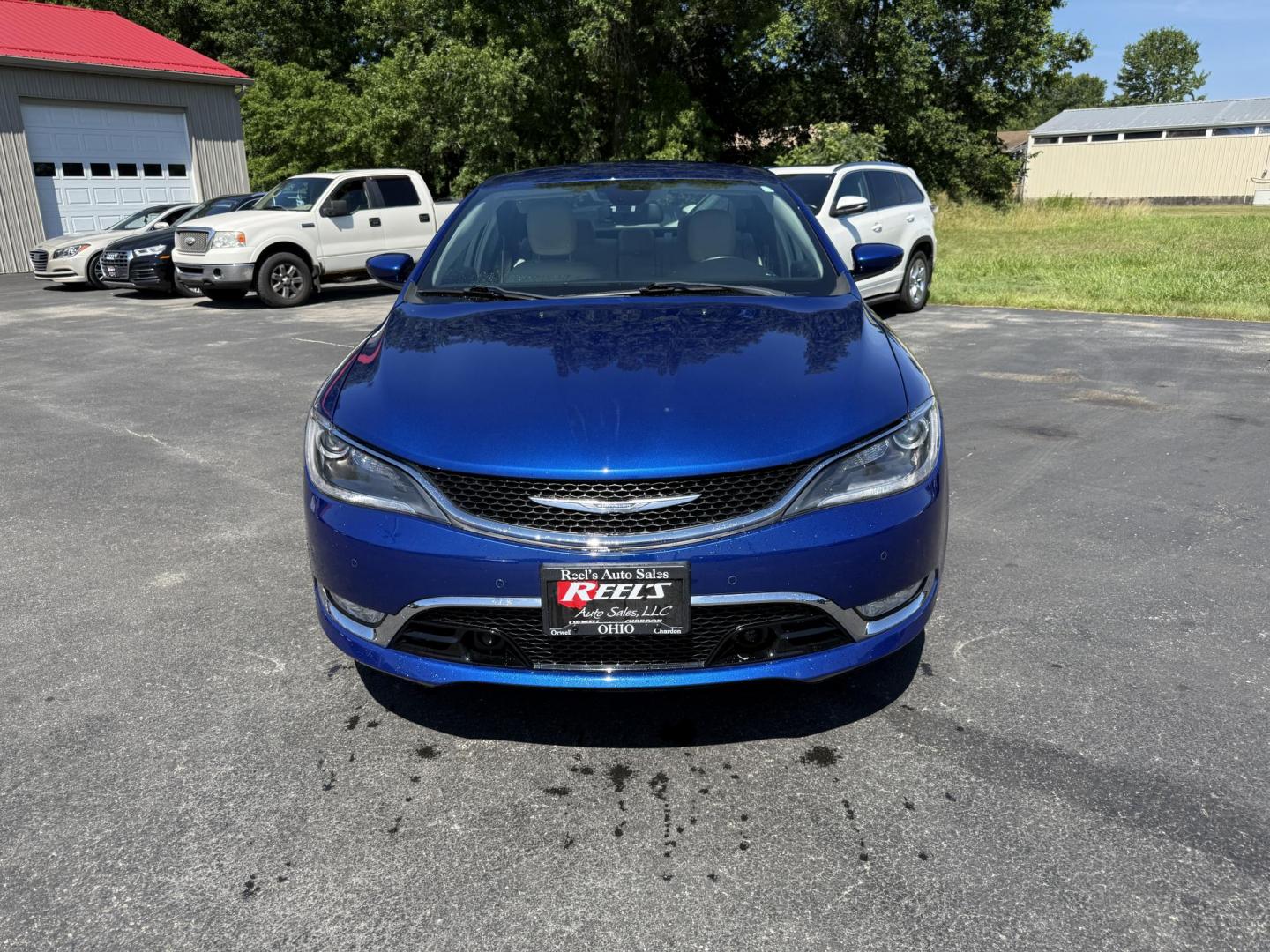 2015 Blue /White Chrysler 200 C (1C3CCCCG2FN) with an 3.6L V6 DOHC 24V engine, 9-Speed Automatic transmission, located at 547 E. Main St., Orwell, OH, 44076, (440) 437-5893, 41.535435, -80.847855 - This 2015 Chrysler 200 C with the 3.6 Pentastar V6 engine offers a compelling blend of performance, comfort, and advanced features, including a 9-speed automatic transmission, leather interior, power front seats, and an 8.4" touchscreen with navigation. It boasts impressive safety and convenience te - Photo#1