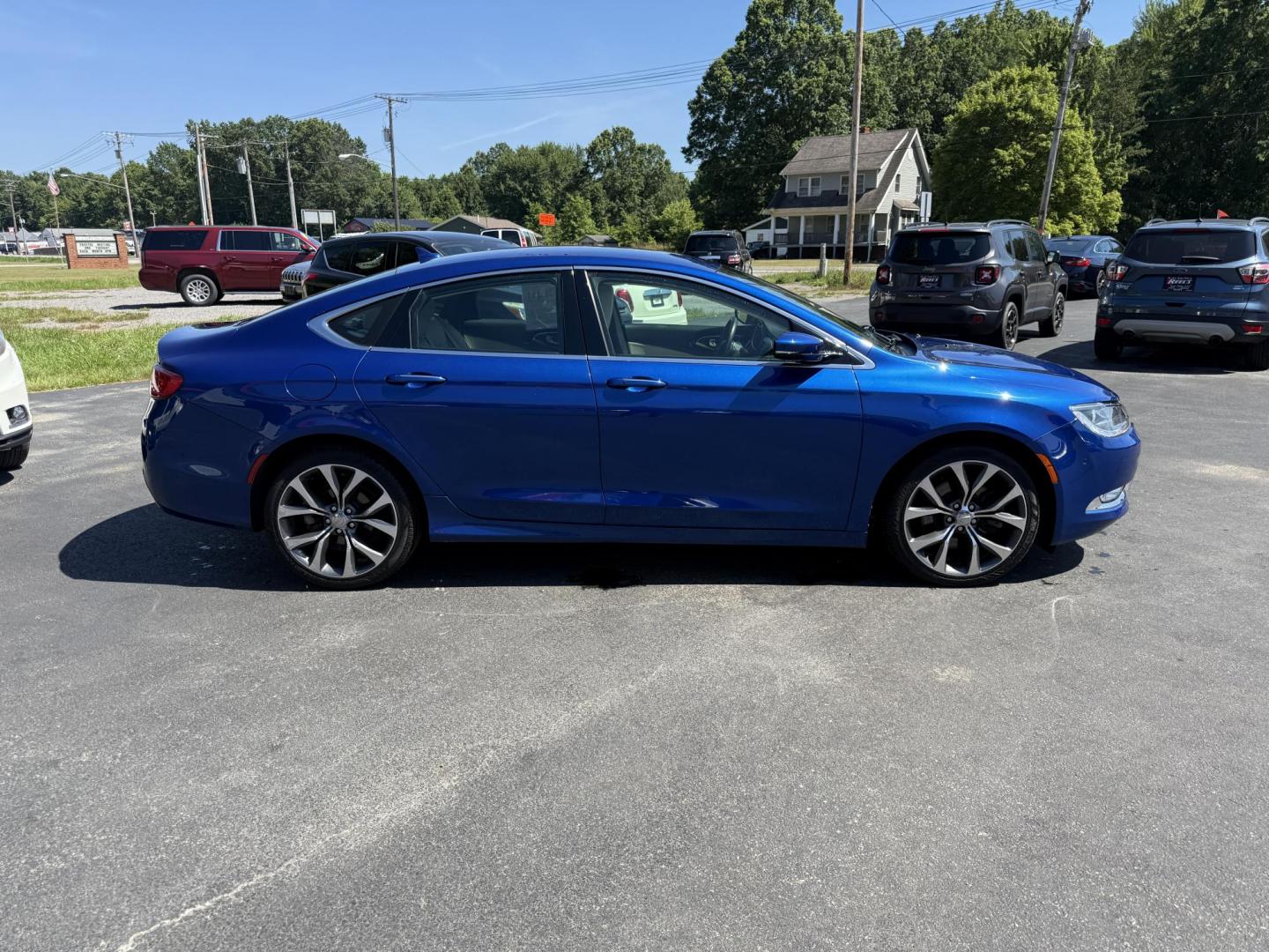 2015 Blue /White Chrysler 200 C (1C3CCCCG2FN) with an 3.6L V6 DOHC 24V engine, 9-Speed Automatic transmission, located at 547 E. Main St., Orwell, OH, 44076, (440) 437-5893, 41.535435, -80.847855 - This 2015 Chrysler 200 C with the 3.6 Pentastar V6 engine offers a compelling blend of performance, comfort, and advanced features, including a 9-speed automatic transmission, leather interior, power front seats, and an 8.4" touchscreen with navigation. It boasts impressive safety and convenience te - Photo#5