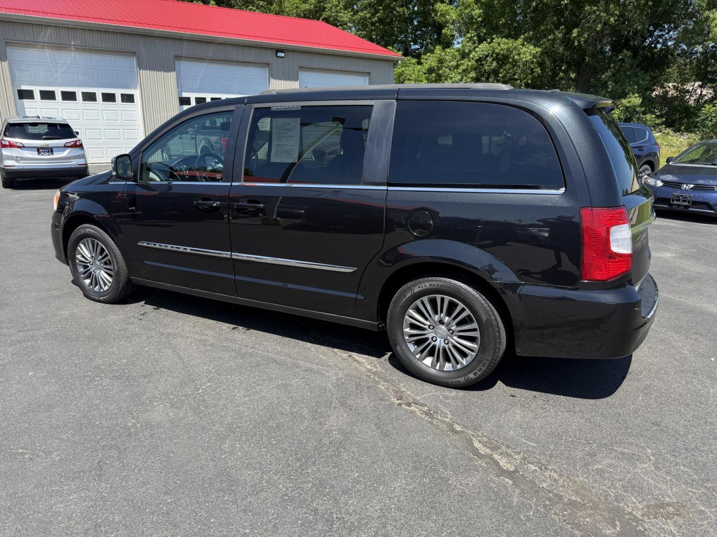 2014 Black /Black Chrysler Town & Country Touring-L (2C4RC1CG9ER) with an 3.6L V6 DOHC 24V FFV engine, 6-Speed Automatic transmission, located at 547 E. Main St., Orwell, OH, 44076, (440) 437-5893, 41.535435, -80.847855 - Photo#10
