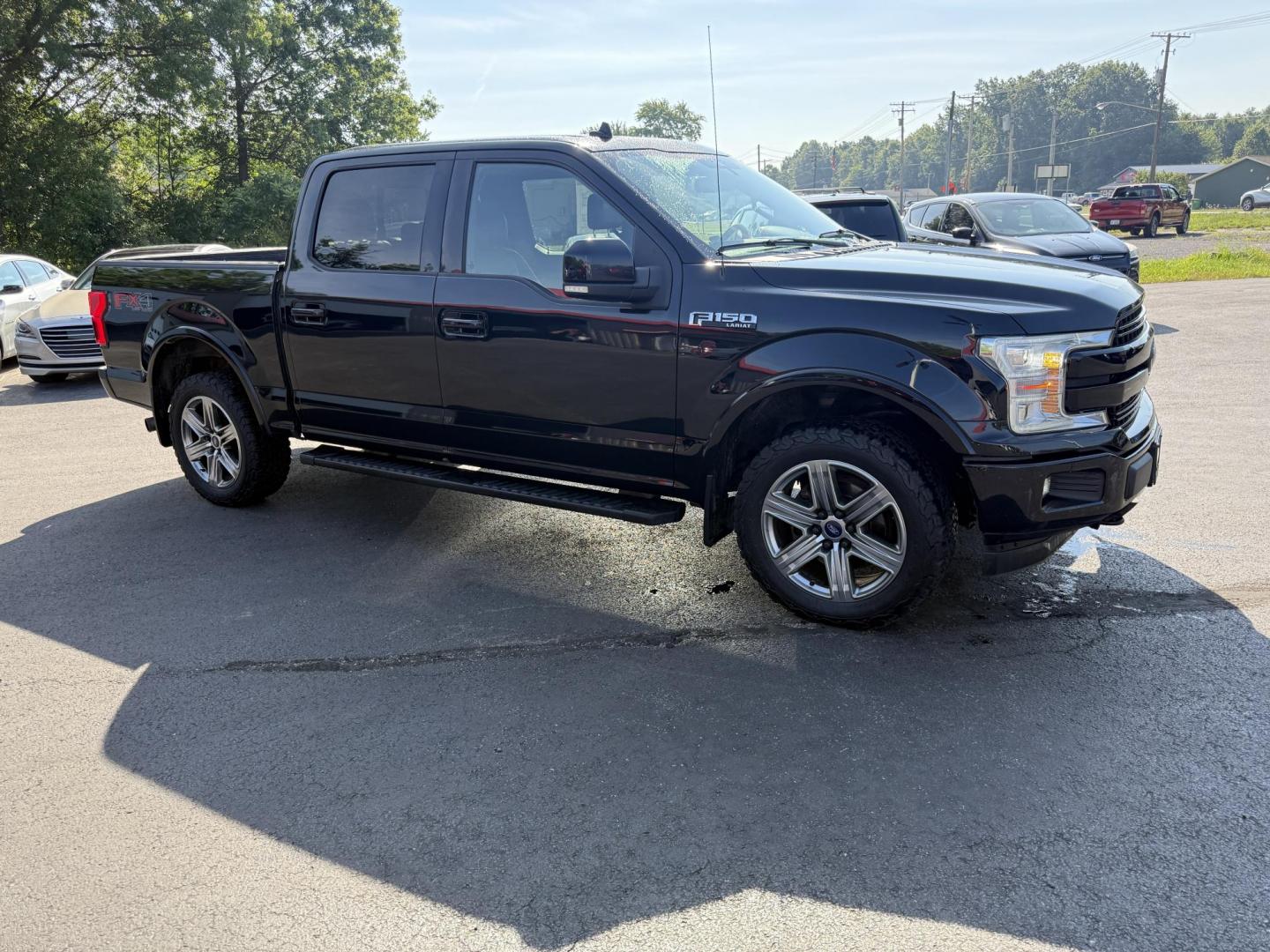 2018 Black /Black Ford F-150 Lariat SuperCrew 5.5-ft. 4WD (1FTEW1E54JF) with an 5.0L V8 OHV 32V FFV engine, 10 Speed Auto transmission, located at 11115 Chardon Rd. , Chardon, OH, 44024, (440) 214-9705, 41.580246, -81.241943 - This 2018 Ford F-150 Lariat Crew Cab 4WD, equipped with the 5.0L Coyote V8 and 10-speed automatic transmission, blends strong performance (395 hp, 400 lb-ft) with luxury features like leather, heated/cooled power seats, dual-zone climate, and advanced tech (Apple CarPlay, Android Auto, navigation). - Photo#3