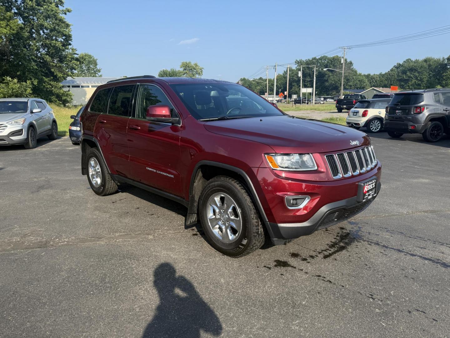 2016 Red /Black Jeep Grand Cherokee Laredo E 4WD (1C4RJFAG4GC) with an 3.6L V6 DOHC 24V engine, 8A transmission, located at 547 E. Main St., Orwell, OH, 44076, (440) 437-5893, 41.535435, -80.847855 - This One Owner 2016 Jeep Grand Cherokee Laredo E 4WD comes equipped with a 3.6L Pentastar V6 engine and an 8-speed automatic transmission, providing a solid balance of power and efficiency. It features a power driver's seat, dual-zone automatic climate control, a 5.0" touchscreen, a 7.0" gauge clust - Photo#2