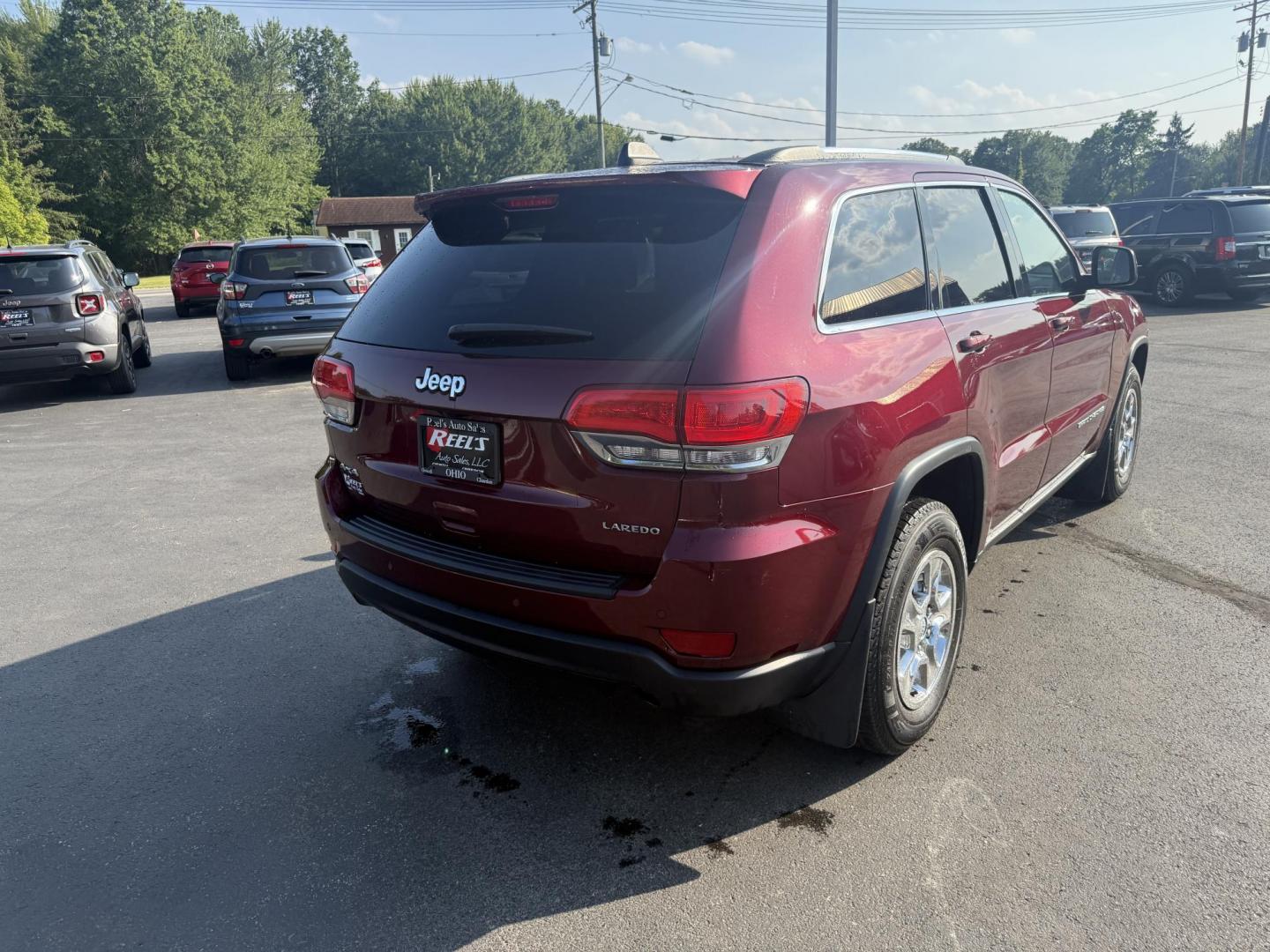 2016 Red /Black Jeep Grand Cherokee Laredo E 4WD (1C4RJFAG4GC) with an 3.6L V6 DOHC 24V engine, 8A transmission, located at 547 E. Main St., Orwell, OH, 44076, (440) 437-5893, 41.535435, -80.847855 - This One Owner 2016 Jeep Grand Cherokee Laredo E 4WD comes equipped with a 3.6L Pentastar V6 engine and an 8-speed automatic transmission, providing a solid balance of power and efficiency. It features a power driver's seat, dual-zone automatic climate control, a 5.0" touchscreen, a 7.0" gauge clust - Photo#7