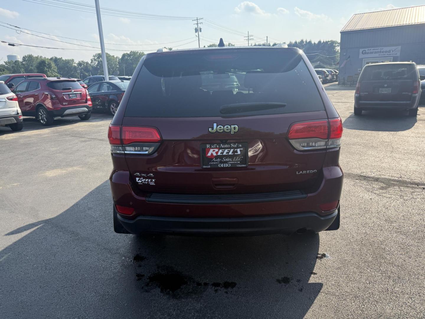 2016 Red /Black Jeep Grand Cherokee Laredo E 4WD (1C4RJFAG4GC) with an 3.6L V6 DOHC 24V engine, 8A transmission, located at 547 E. Main St., Orwell, OH, 44076, (440) 437-5893, 41.535435, -80.847855 - This One Owner 2016 Jeep Grand Cherokee Laredo E 4WD comes equipped with a 3.6L Pentastar V6 engine and an 8-speed automatic transmission, providing a solid balance of power and efficiency. It features a power driver's seat, dual-zone automatic climate control, a 5.0" touchscreen, a 7.0" gauge clust - Photo#8