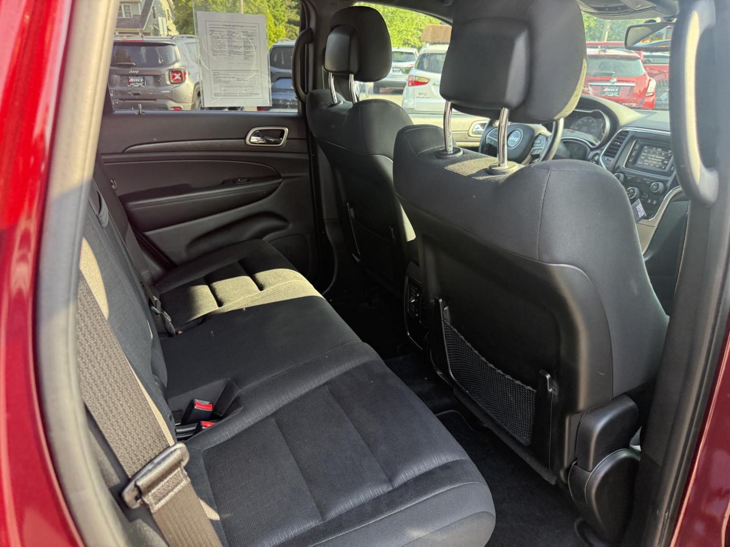 2016 Red /Black Jeep Grand Cherokee Laredo E 4WD (1C4RJFAG4GC) with an 3.6L V6 DOHC 24V engine, 8A transmission, located at 547 E. Main St., Orwell, OH, 44076, (440) 437-5893, 41.535435, -80.847855 - This One Owner 2016 Jeep Grand Cherokee Laredo E 4WD comes equipped with a 3.6L Pentastar V6 engine and an 8-speed automatic transmission, providing a solid balance of power and efficiency. It features a power driver's seat, dual-zone automatic climate control, a 5.0" touchscreen, a 7.0" gauge clust - Photo#34
